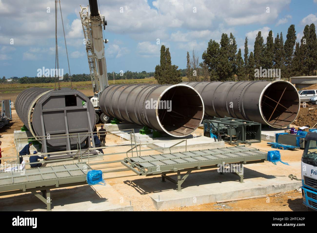 Large diameter water pipes are being placed in the ground Stock Photo