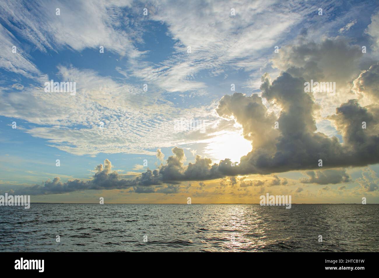 Beautiful shot of a bright sunset sky with clouds over a sea Stock ...