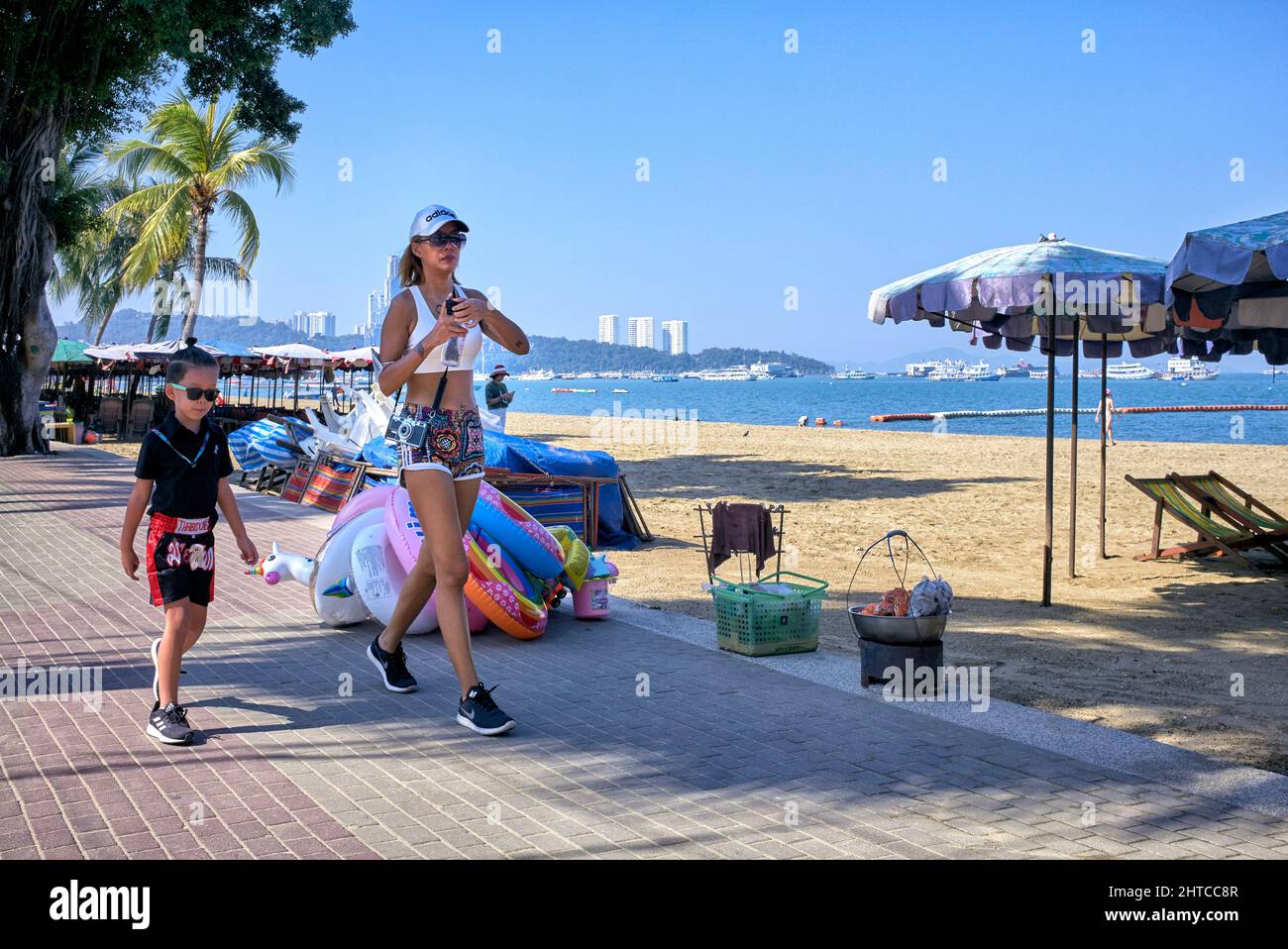 Mother and son wearing fashion trendy clothes and accessories whilst