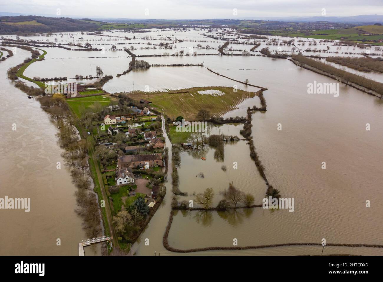 Properties are surrounded by water as the River Severn floods around