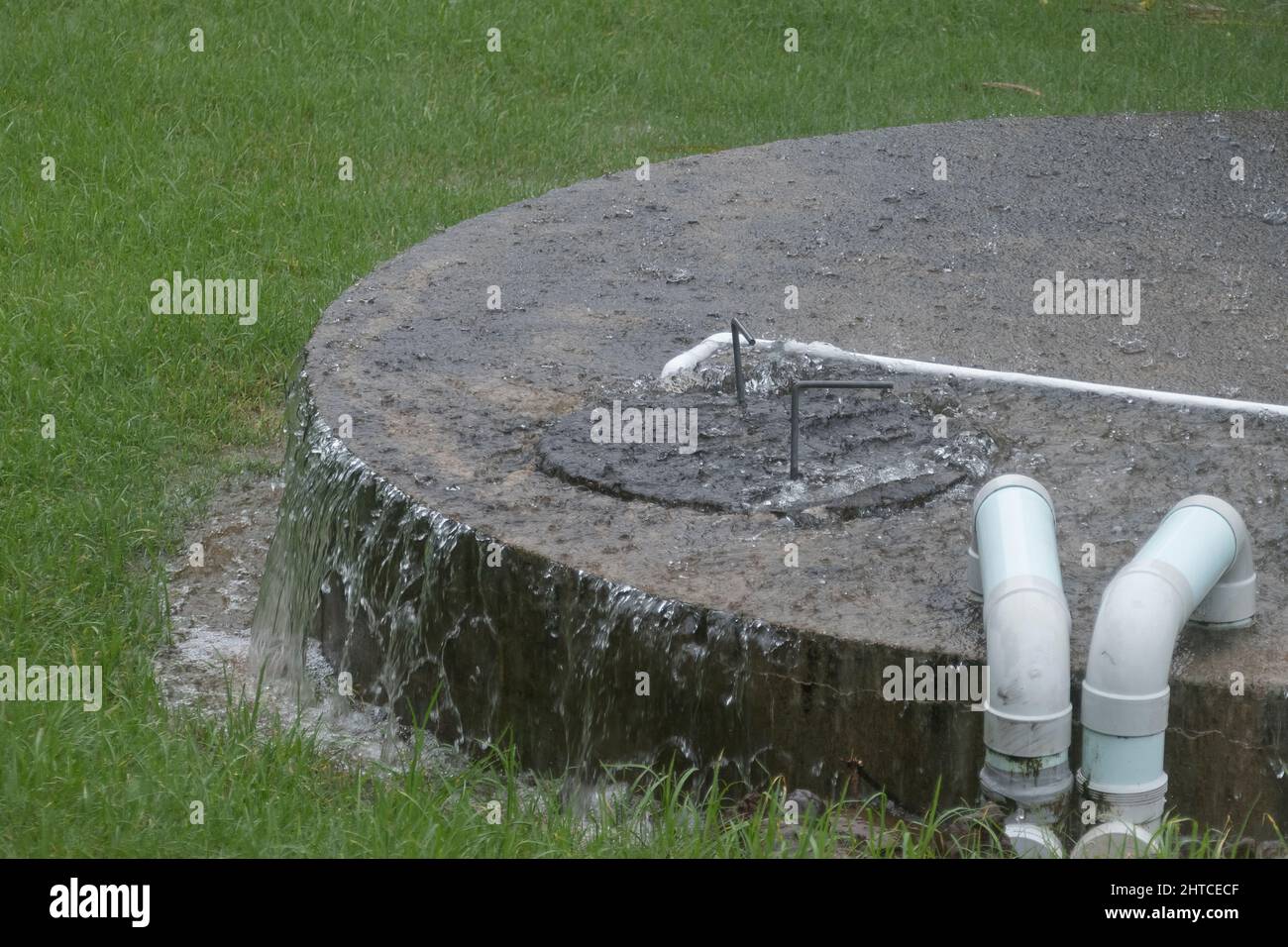 Domestic rainwater collection tank (33000 litres) overflowing during