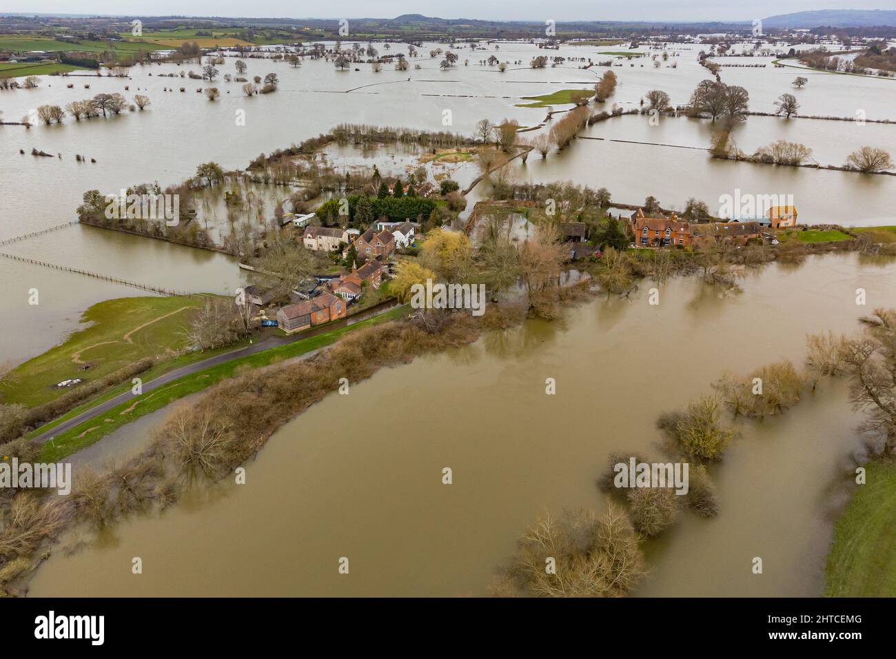 Properties are surrounded by water as the River Severn floods around