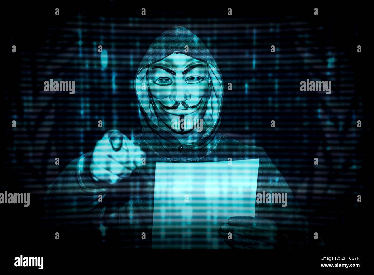 Milan, Italy. February 28th, 2022. Man with a mask from the decentralized group of activists anonymous hackers issues a statement against Putin about Stock Photo