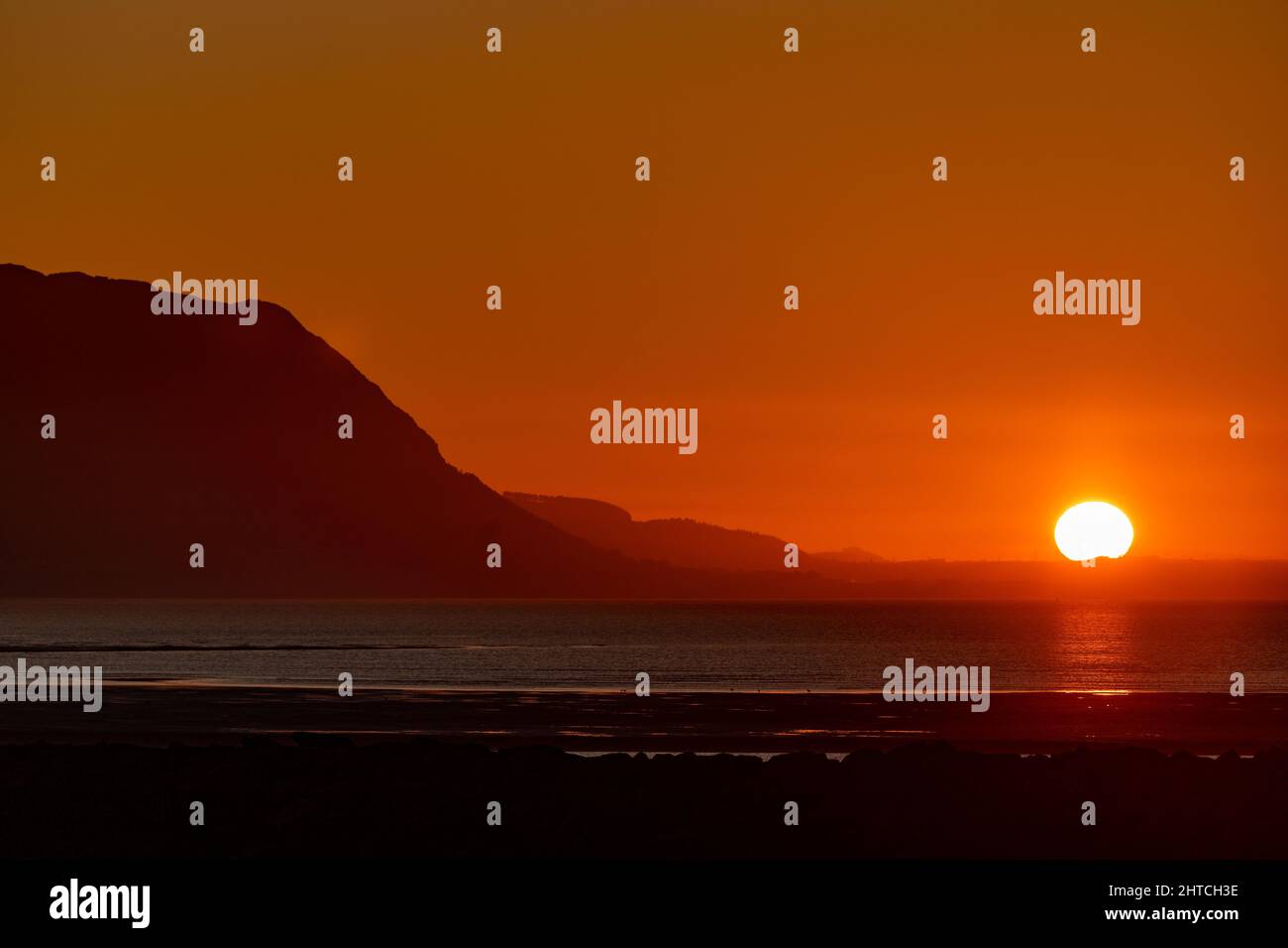 Sunset over the North Wales coast from Llandudno West Shore Stock Photo