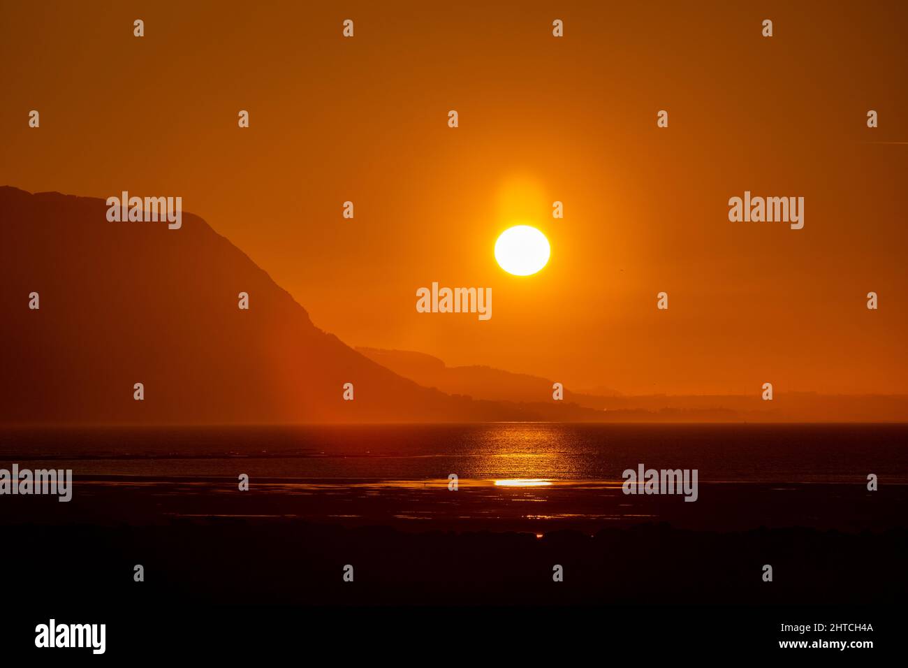Sunset over the North Wales coast from Llandudno West Shore Stock Photo