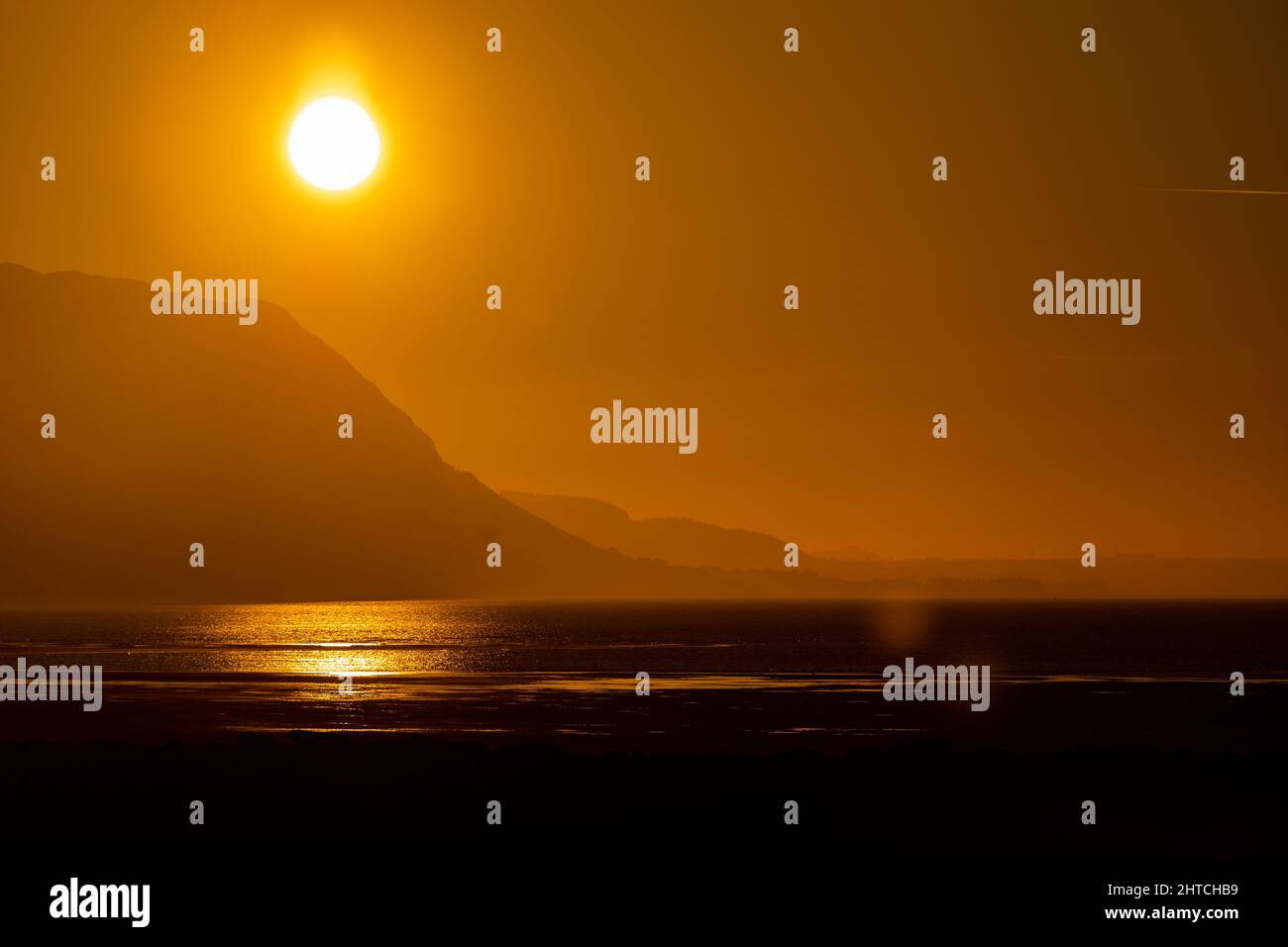Sunset over the North Wales coast from Llandudno West Shore Stock Photo