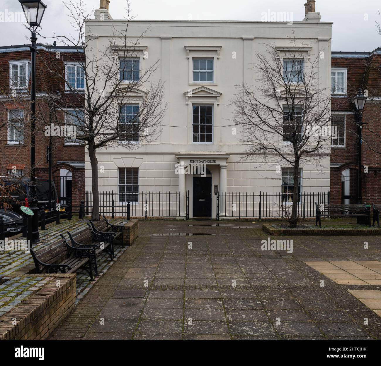 John Day House on a square with benches and classic street light, Old