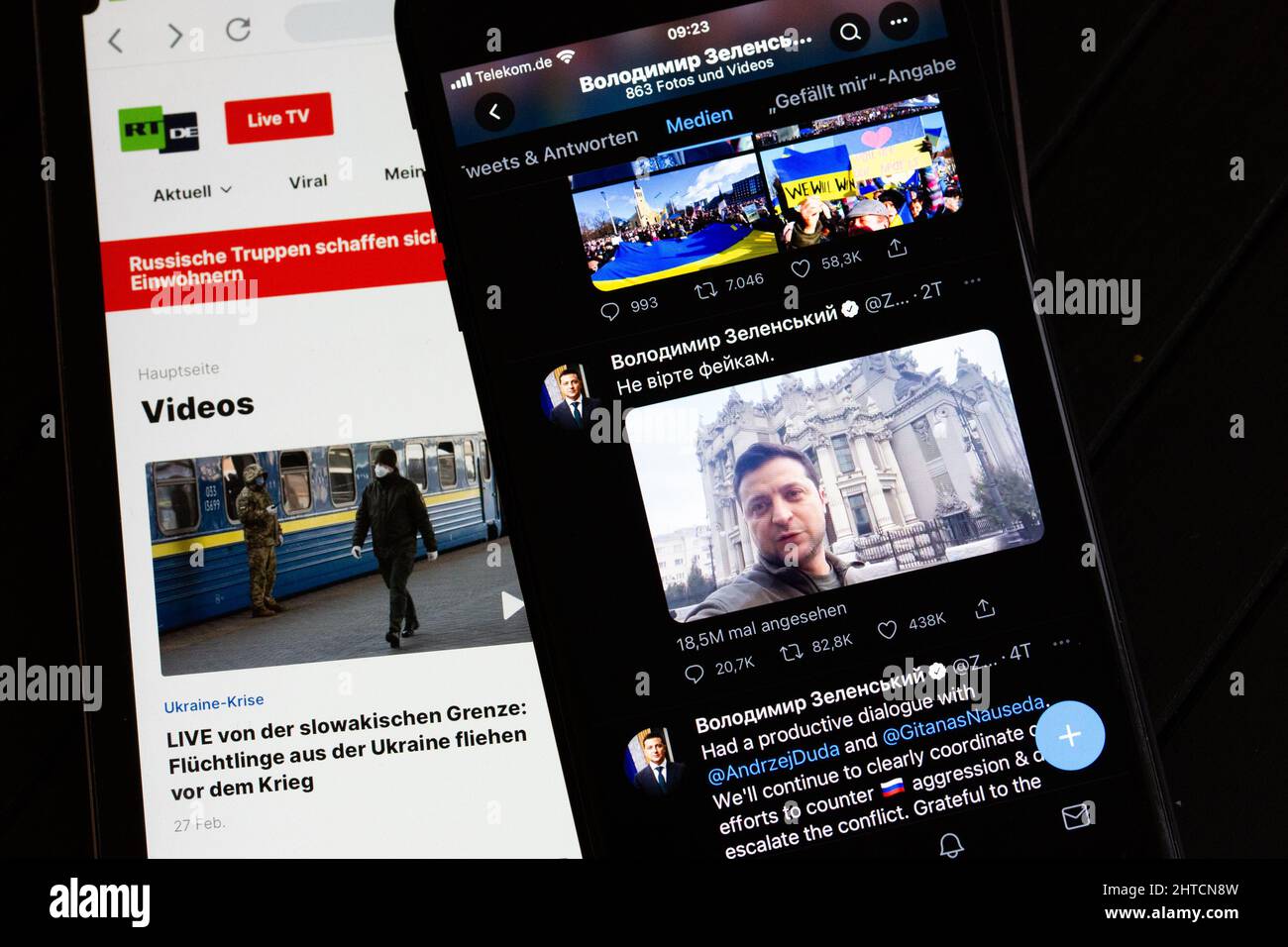 Berlin, Germany. 28th Feb, 2022. On the screen of a tablet (l), the website of the Russian TV channel RT can be seen. On the right, the screen of a smartphone shows the official Twitter account of Ukrainian President Selenskyj. (to dpa 'Russia and Ukraine fight for sovereignty of opinion in social media') Credit: Fernando Gutierrez-Juarez/dpa-Zentralbild/dpa/Alamy Live News Stock Photo