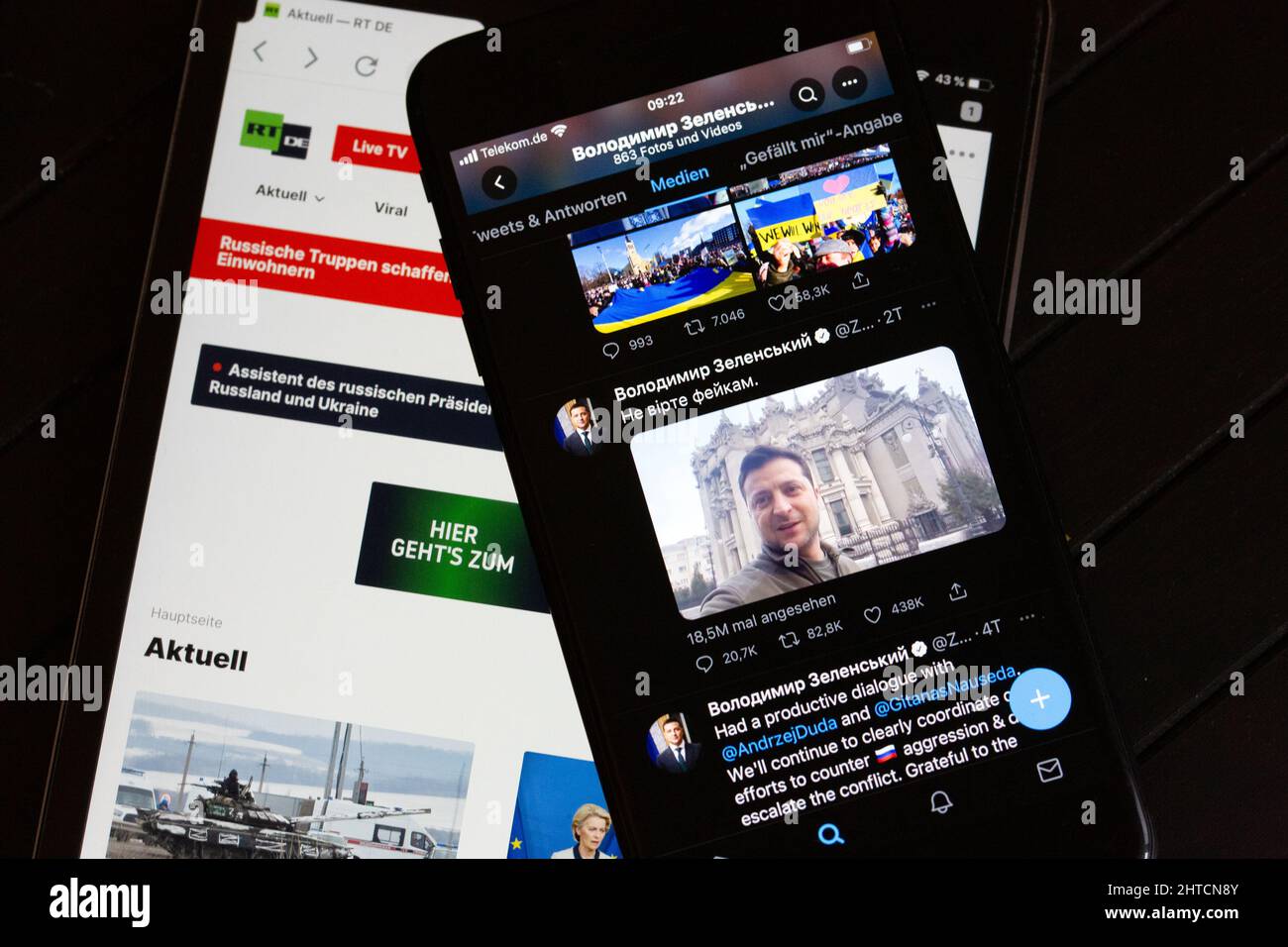 Berlin, Germany. 28th Feb, 2022. On the screen of a tablet (l), the website of the Russian TV channel RT can be seen. On the right, the screen of a smartphone shows the official Twitter account of Ukrainian President Selenskyj. (to dpa 'Russia and Ukraine fight for sovereignty of opinion in social media') Credit: Fernando Gutierrez-Juarez/dpa-Zentralbild/dpa/Alamy Live News Stock Photo