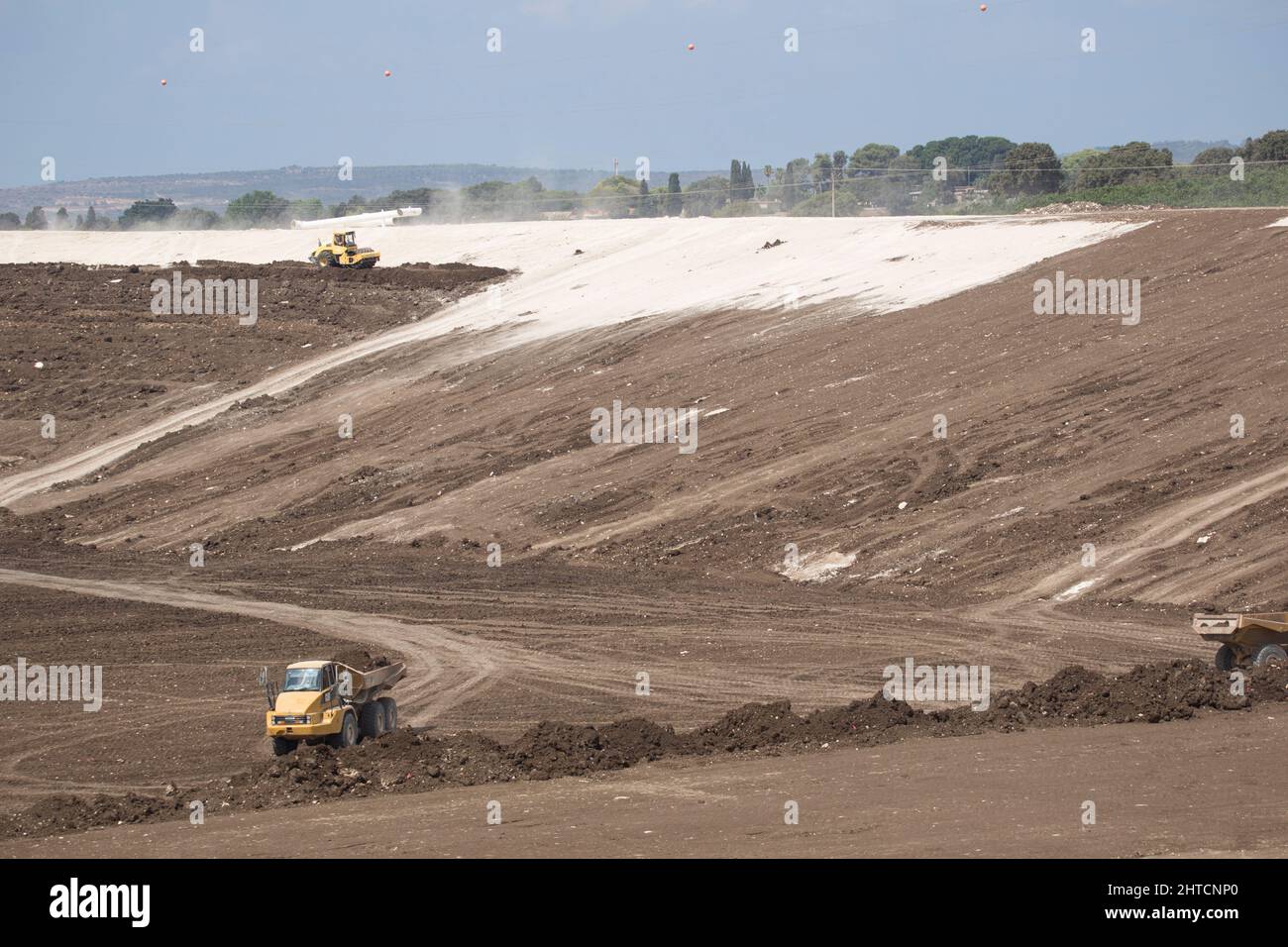 Heavy earth moving equipment clearing the ground for a large scale civil engineering project Stock Photo