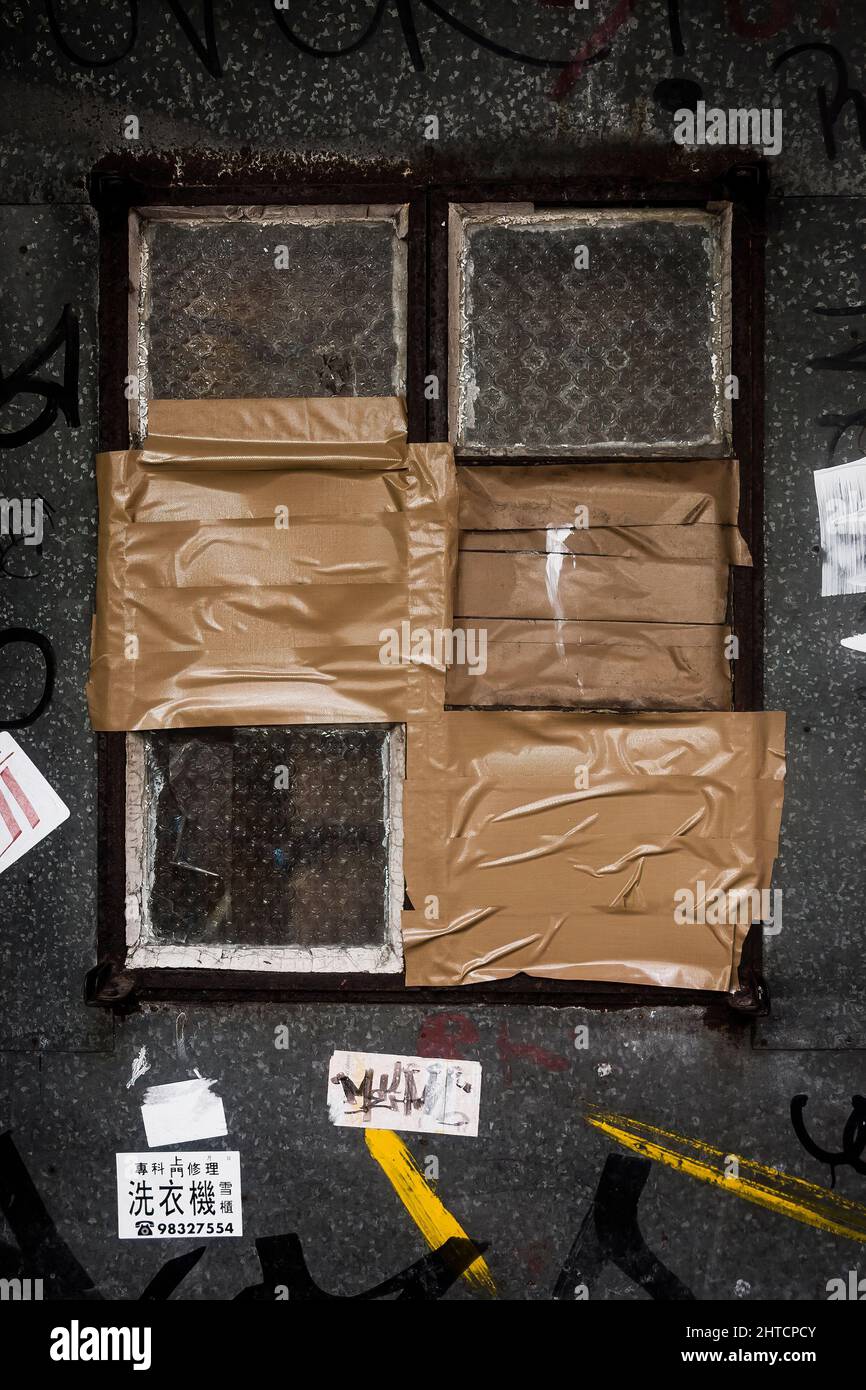 A window repaired with duct tape in Stanley Market, Hong Kong Island