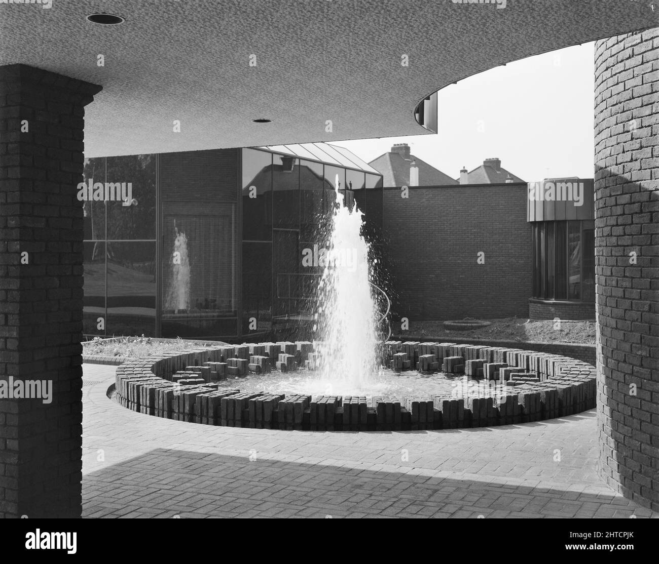 Sir John Laing Building, Page Street, Mill Hill, Barnet, London, 15/05/1981. A fountain outside the front entrance of the Sir John Laing Building, Mill Hill. The Sir John Laing Building, named in honour of the company's president who died in January 1978 at the age of 98, was built between 1977 and 1980 having been planned since 1974.  The building completed a phase of development at Laing's Mill Hill headquarters complex, an area that the firm had occupied since moving from Carlisle in 1922.  By 1988 however a major restructuring of the company and meant a wholesale relocation out of the Mill Stock Photo