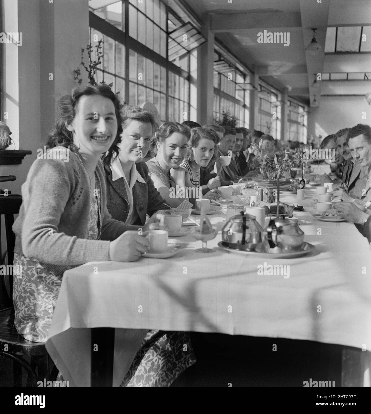 The Spa, Bridlington, East Riding of Yorkshire, 19/06/1948. A group of people having lunch at a long table in the Spa Cafe during a day trip of Laing staff to Bridlington. This day trip was for contracts in the North West area, including those at Darlington, Doncaster, Bolton on Dearne, Stubbs Wood, Huddersfield and Wigfield. W. K. Laing also joined the outing. Stock Photo