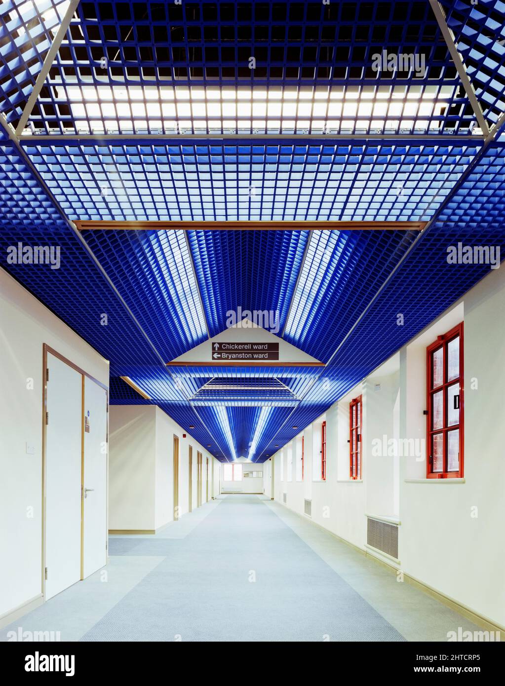 West Dorset County Hospital, Dorchester, West Dorset, Dorset, 08/04/1987. A view along a corridor at West Dorset County Hospital showing the decorative suspended ceiling. In the early 1980s plans were developed for a modern hospital to replace the old Dorchester Hospital, at a new site to the west of the town centre. A joint venture of Laing&#x2019;s South West Region and Haden Young Limited were responsible for Phase I of the construction project, which was to provide 149 beds and included maternity and geriatric units, two operating theatres and a pathology and X-ray department. Phase I on t Stock Photo