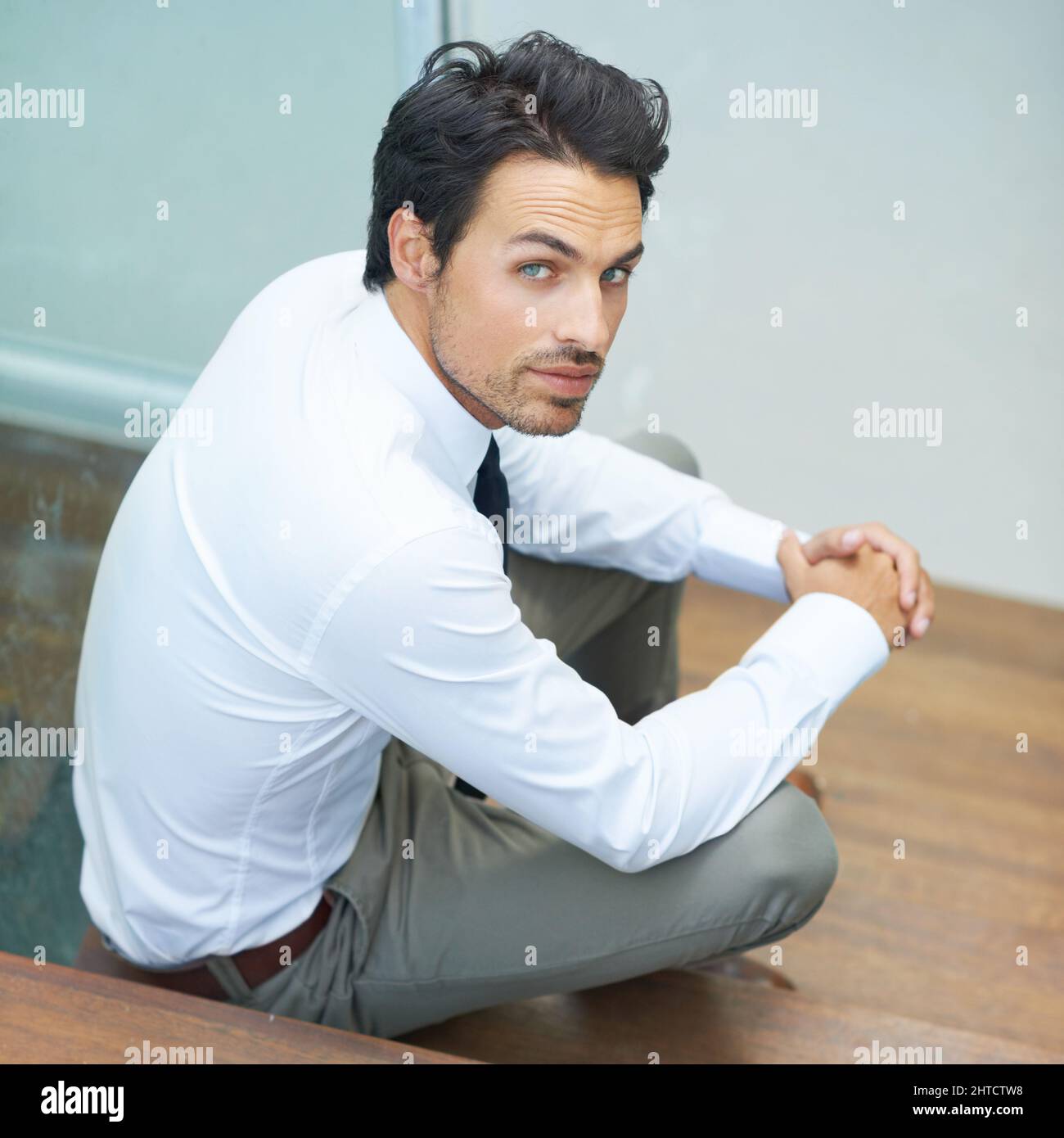 Trendy guy sitting down hi-res stock photography and images - Alamy