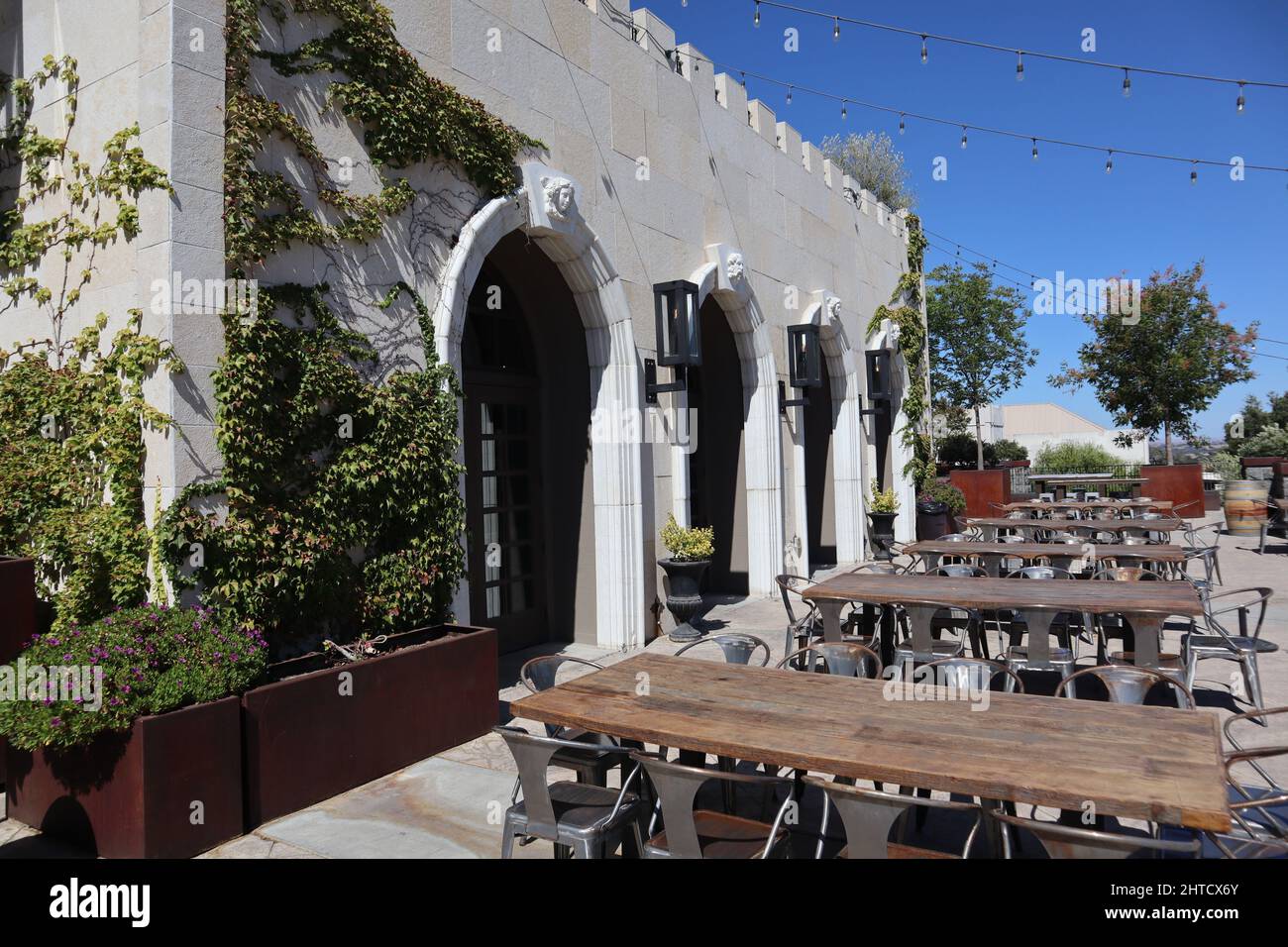 Outdoor patio of restaurant with Mediterranean architecture Stock Photo ...