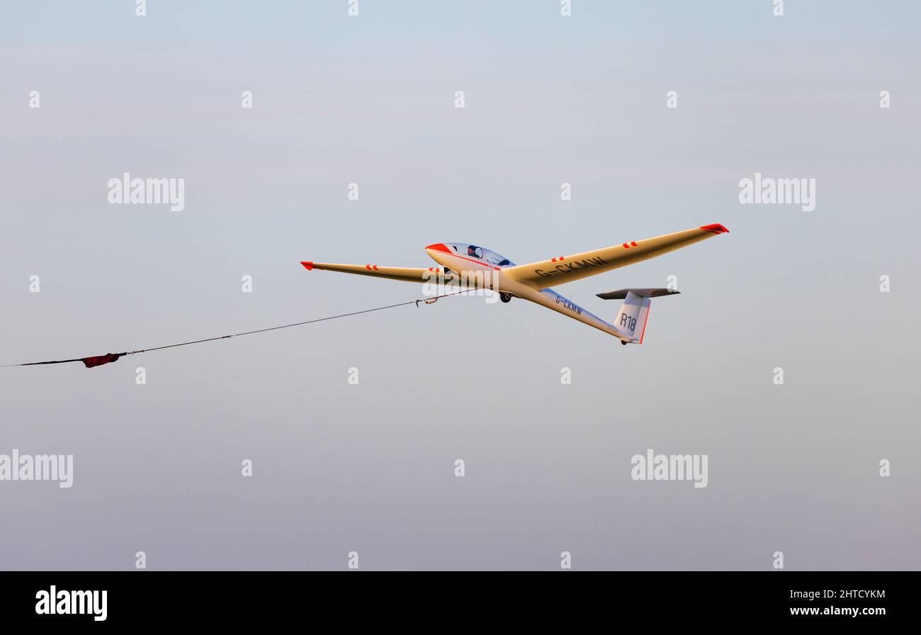 Alexander Schleicher ASK21 two seat training glider, R18 G-CKMW, of the Royal Air Force Gliding and Soaring Association (RAFGSA) winch launches at the Stock Photo