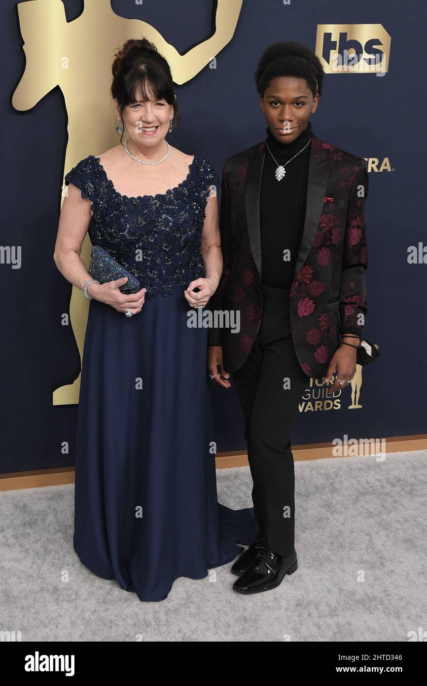 Los Angeles, USA. 27th Feb, 2022. Ann Dowd and Trust Arancio arrive at the 28th Screen Actors Guild Awards held at the Barker Hangar in Santa Monica, CA on Sunday, ?February 27, 2022. (Photo By Sthanlee B. Mirador/Sipa USA) Credit: Sipa USA/Alamy Live News Stock Photo