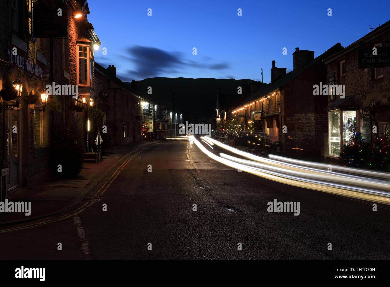 Christmas Lights along Cross Street, Castleton village, Derbyshire, Peak District National Park, England, UK Stock Photo