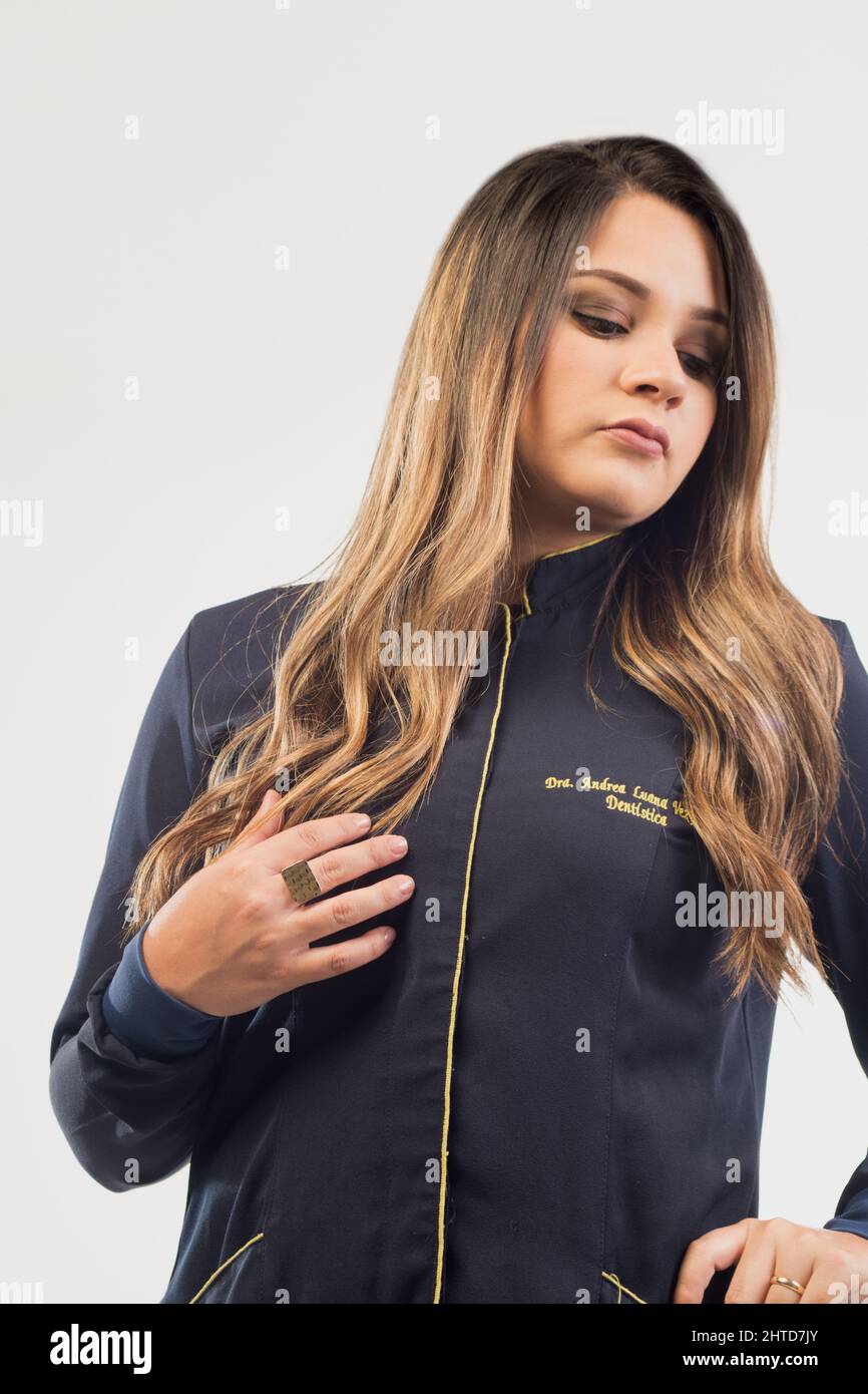 Latina girl in a black jacket posing on the white background Stock ...