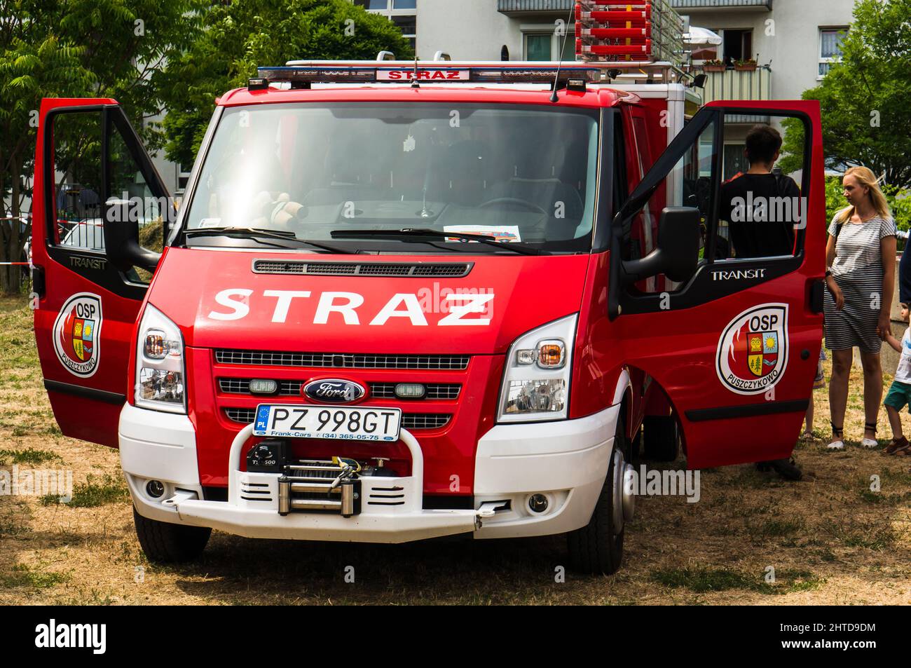 Fire Van Front view of a fire department van with open doors and people, Poznan ...