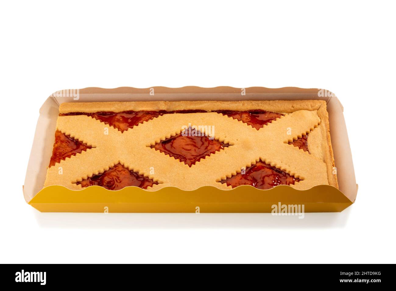 Square jam tart in cardboard tray, pie crostata with apricot jam isolated on white, clipping path Stock Photo