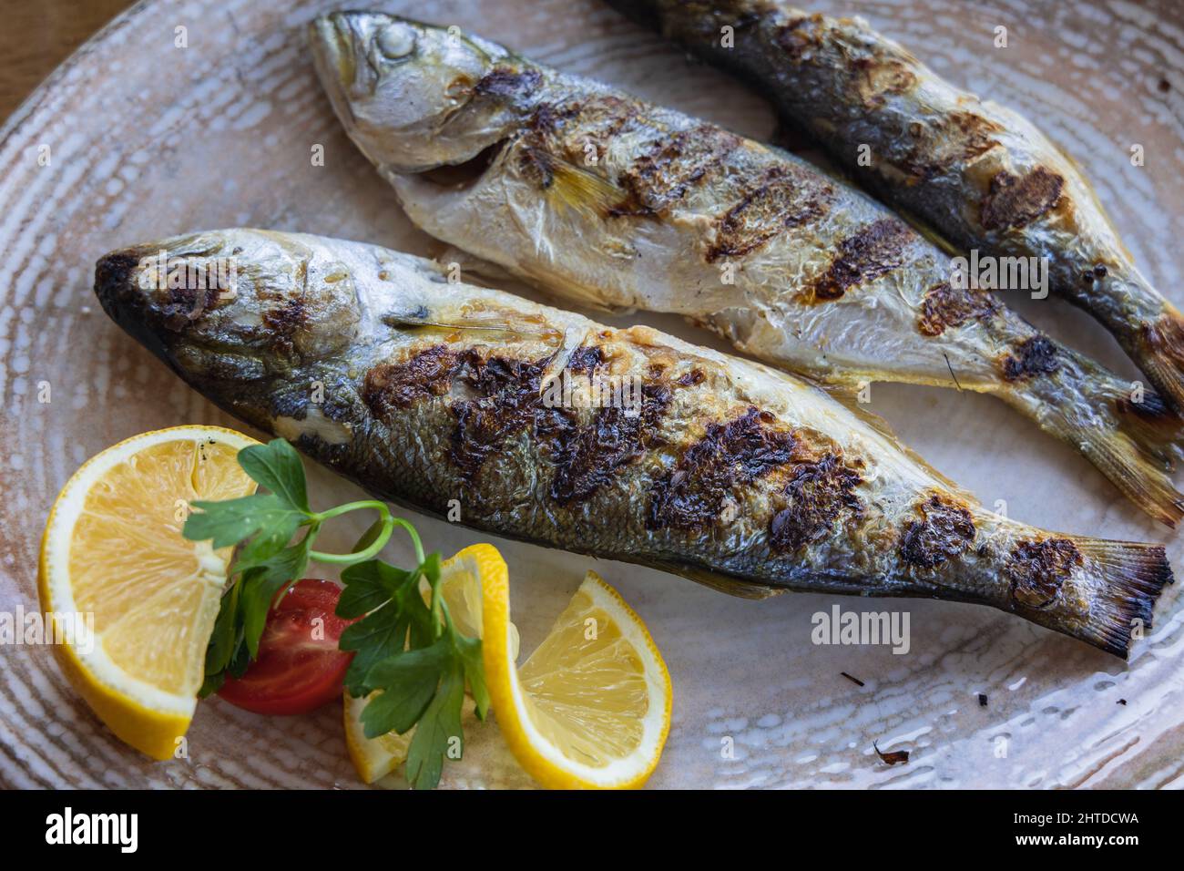 Grilled bluefishes in restaurant in Sozopol historic seaside town in Burgas Province on the southern Black Sea Coast in Bulgaria Stock Photo