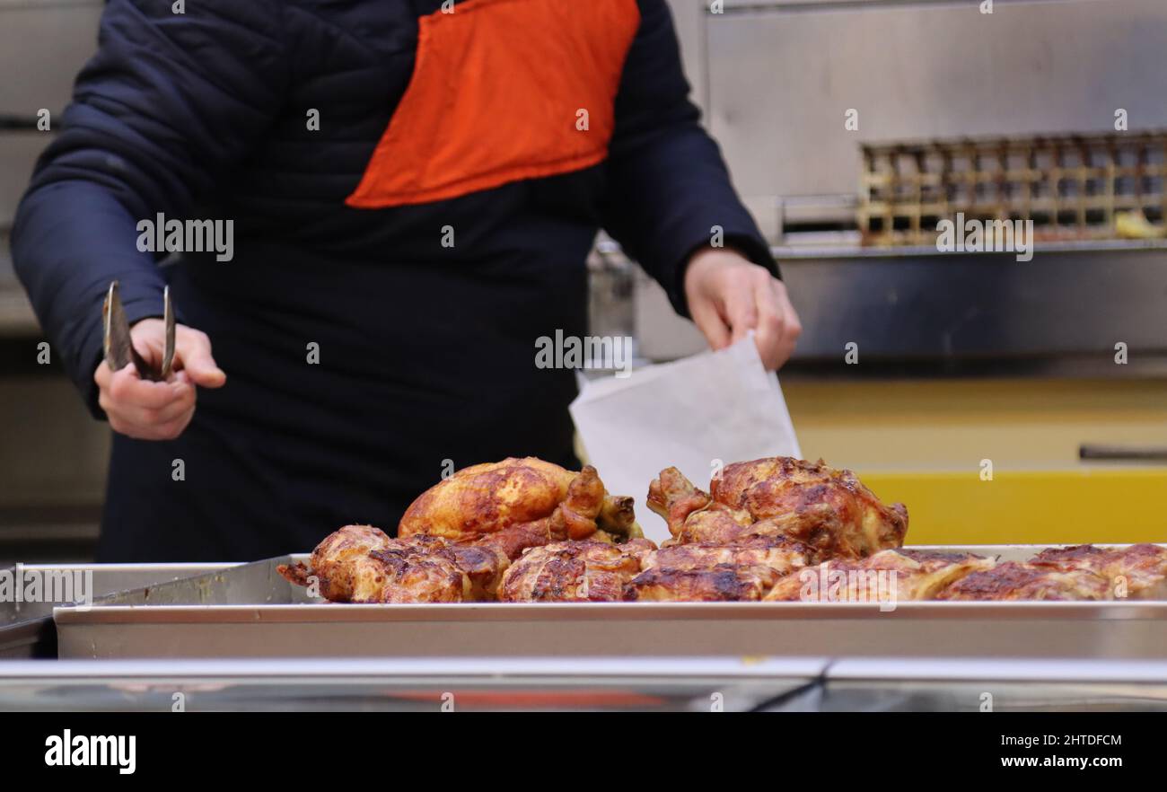 Chef preparing the chicken with fresh meat ready to grill with condiment Stock Photo