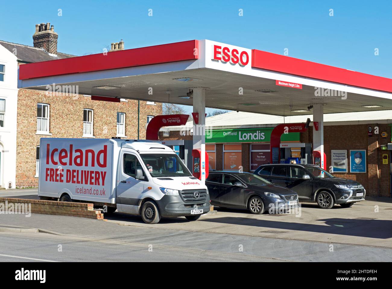 Iceland delivery van filling up at Esso petrol station in Driffield, East Yorkshire, England UK Stock Photo