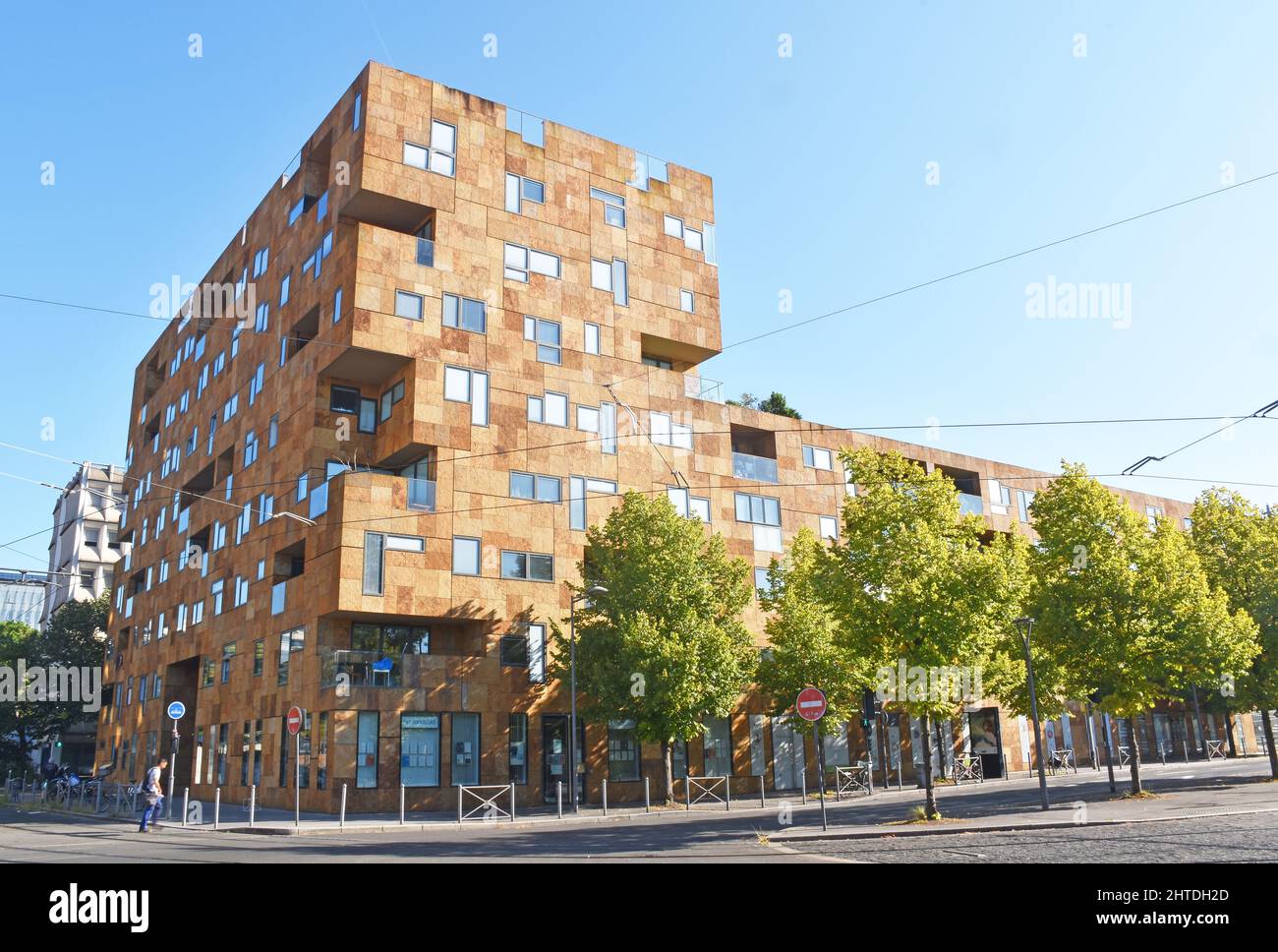 Square Pey Berland, a large modern apartment building in Bordeaux,  mostly 8 storeys, something of a Lego-look, various shades of brown stone cladding Stock Photo