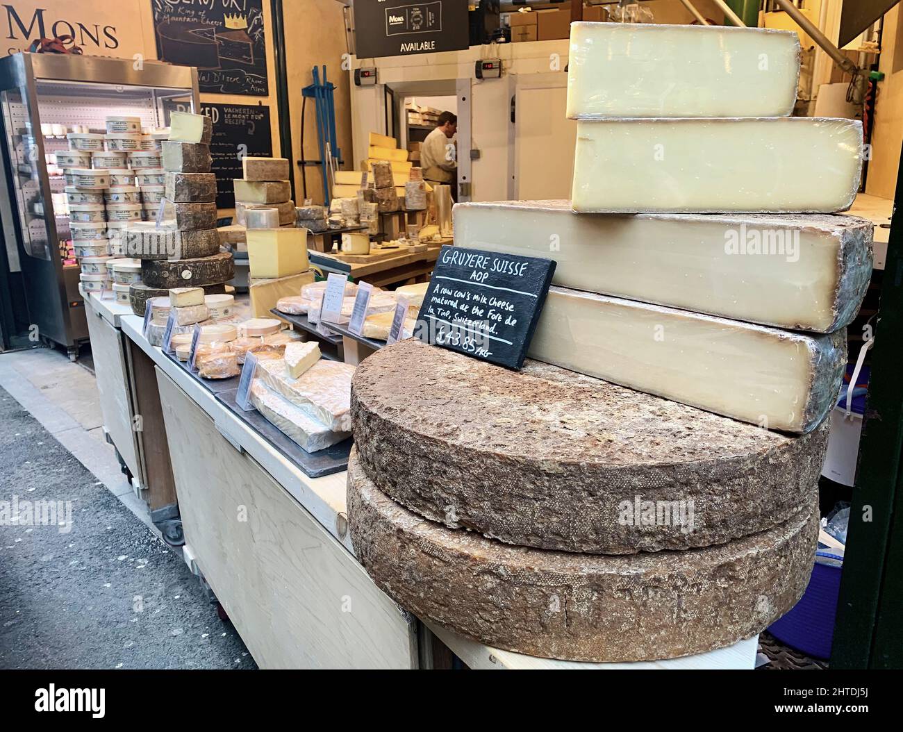 A stall selling Gruyere Swiss cheese in Borough Market, London, UK