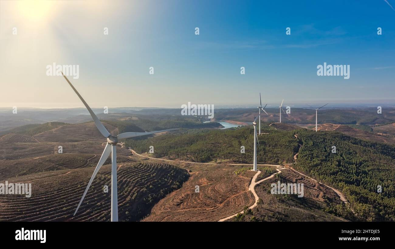 Aerial view wind turbine eco friendly renewable energy concept on Portuguese mountains background. Sunny day Stock Photo