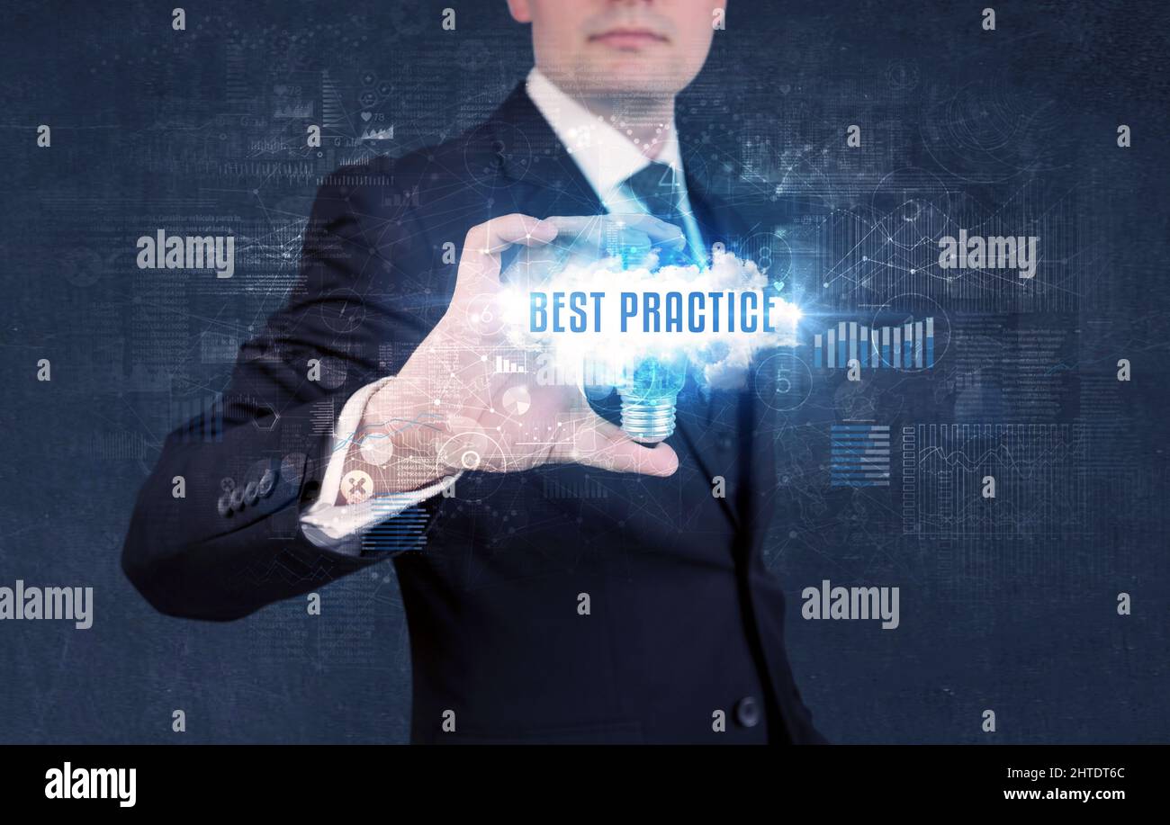 Businessman holding a light bulb, business concept Stock Photo - Alamy
