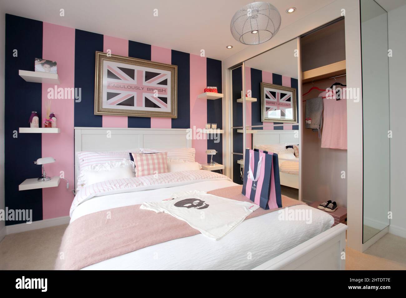 Modern bedroom in new build home,bedspread,pink beige colour scheme,Jack Wills theme Stock Photo