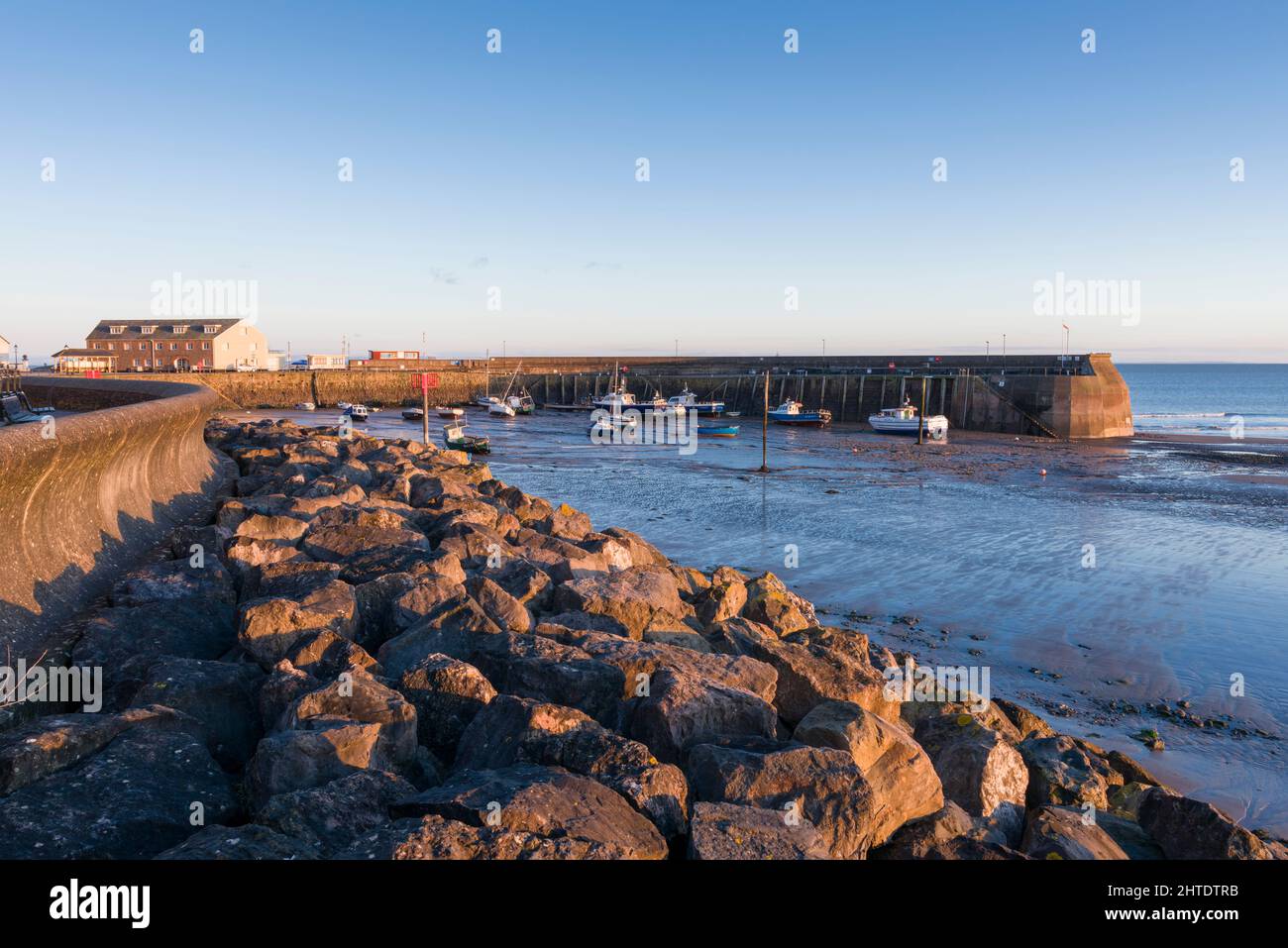 The sea wall and harbour beyond at the coastal town of Minehead, Somerset, England. Stock Photo