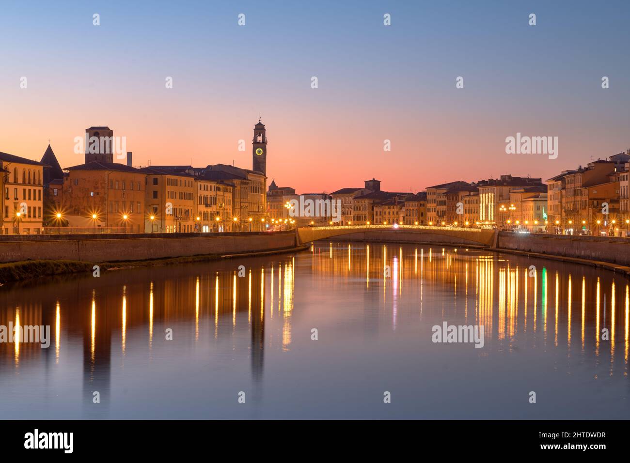 Pisa, Italy skyline on the Arno River at dusk. Stock Photo