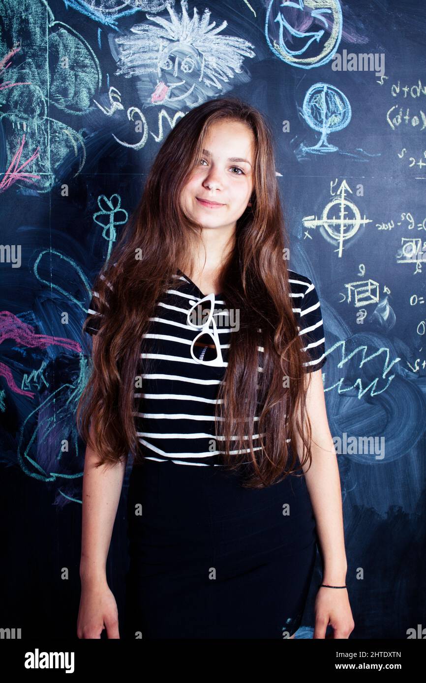 back to school after summer vacations, cute teen girl in classroom ...