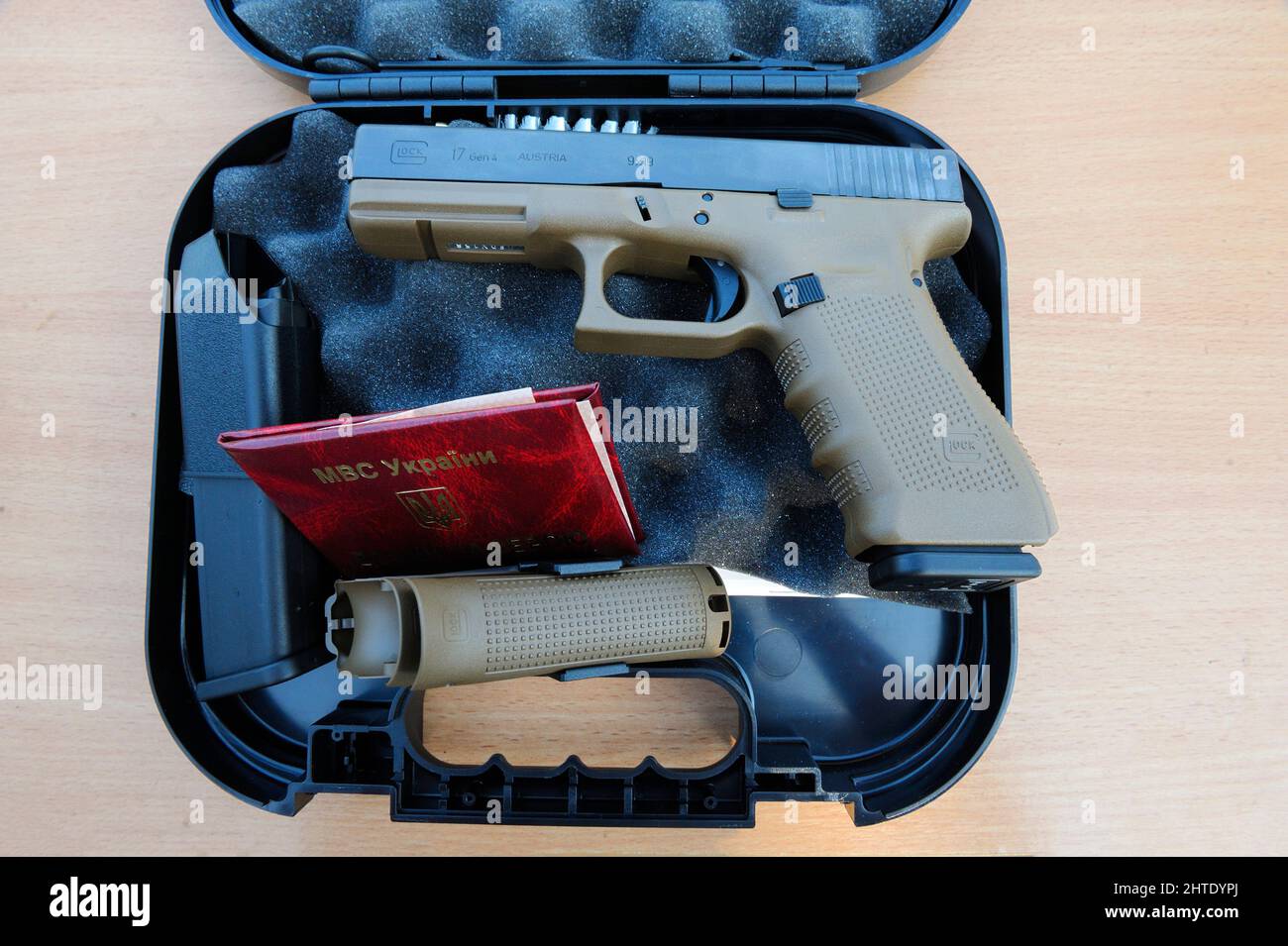 Fire-Arm Glock placed on a box. It was awarded soldiers of KORD police special forces, Ukrainian SWAT Stock Photo