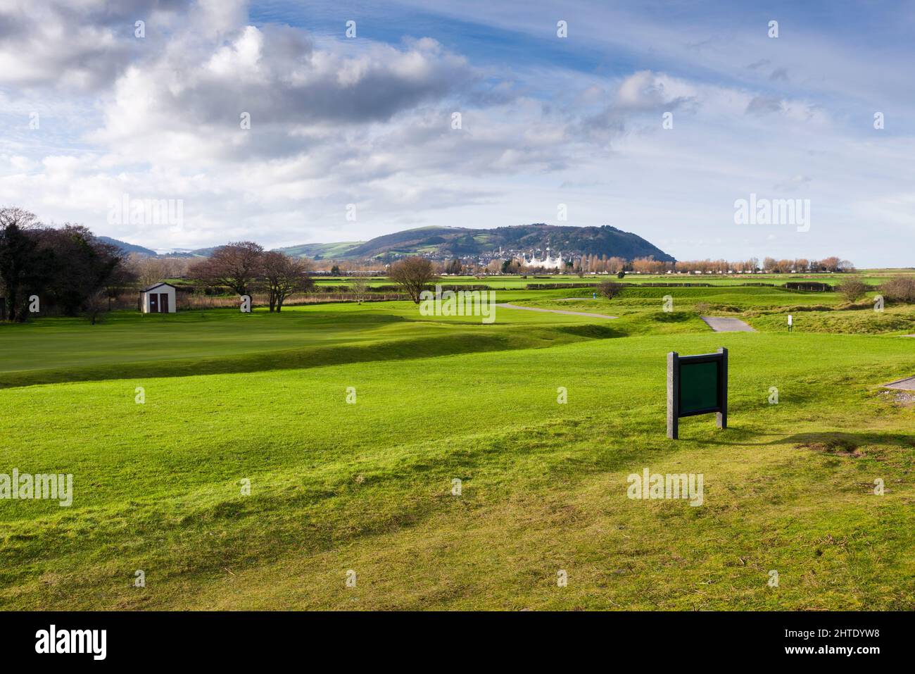 The Minehead and West Somerset Golf Club from the coast path with Minehead and the hills of Exmoor National Park in the distance, Somerset, England. Stock Photo