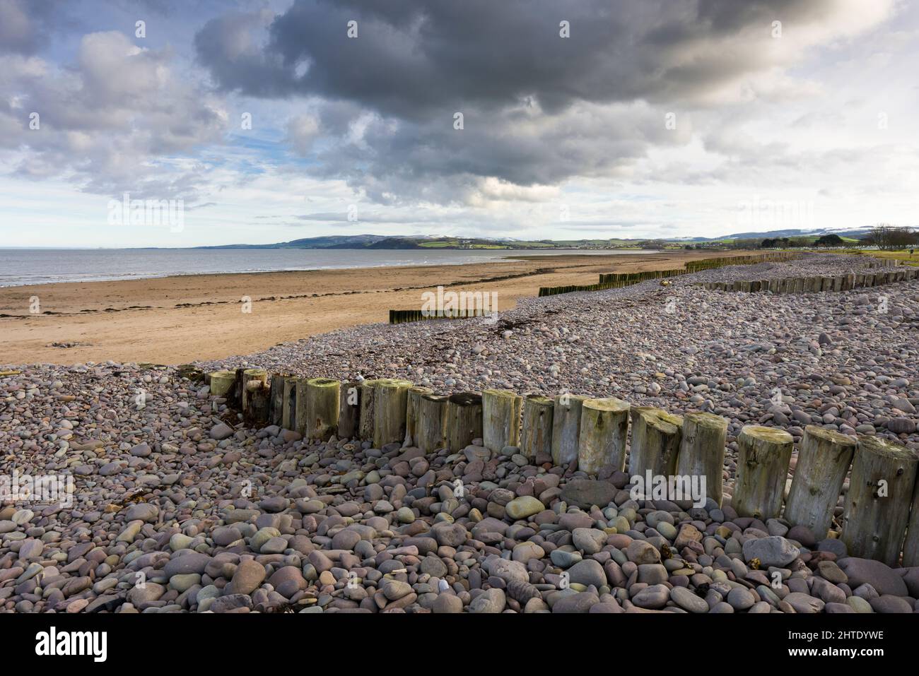 Dunster Beach and Blue Anchor Bay in the Bristol Channel with the Quantock Hills beyond in winter, Somerset, England. Stock Photo