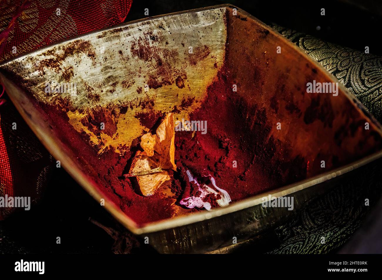 Photo of red henna in a metal bowl Stock Photo