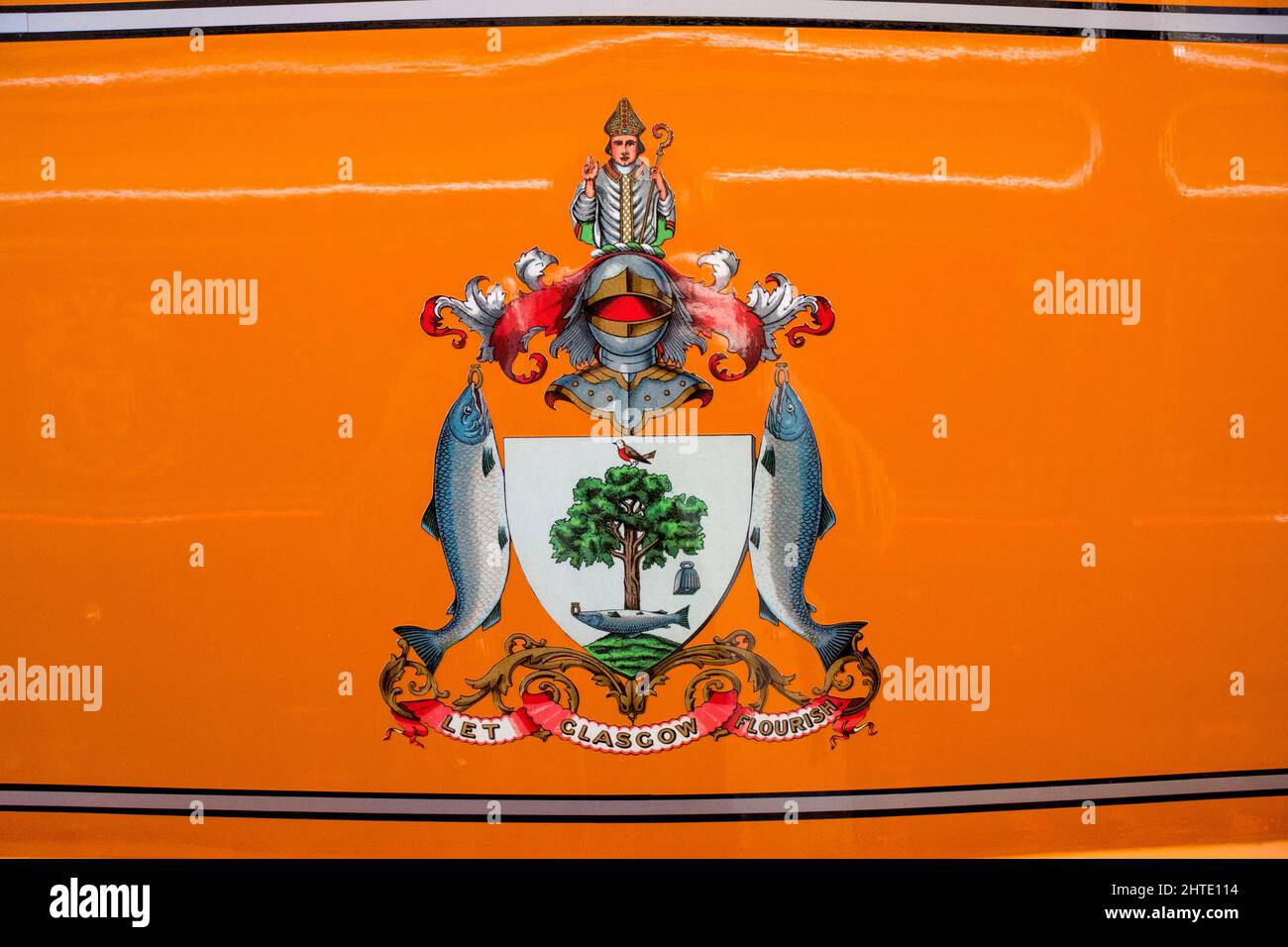Derbyshire, UK – 5 April 2018: Let Glasgow Flourish insignia with knight, fish and tree of life on the orange paintwork of a restored tram at Crich Tr Stock Photo
