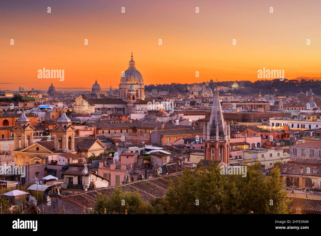 Italy, Rome cityscape with historic buildings and cathedrals at dusk. Stock Photo