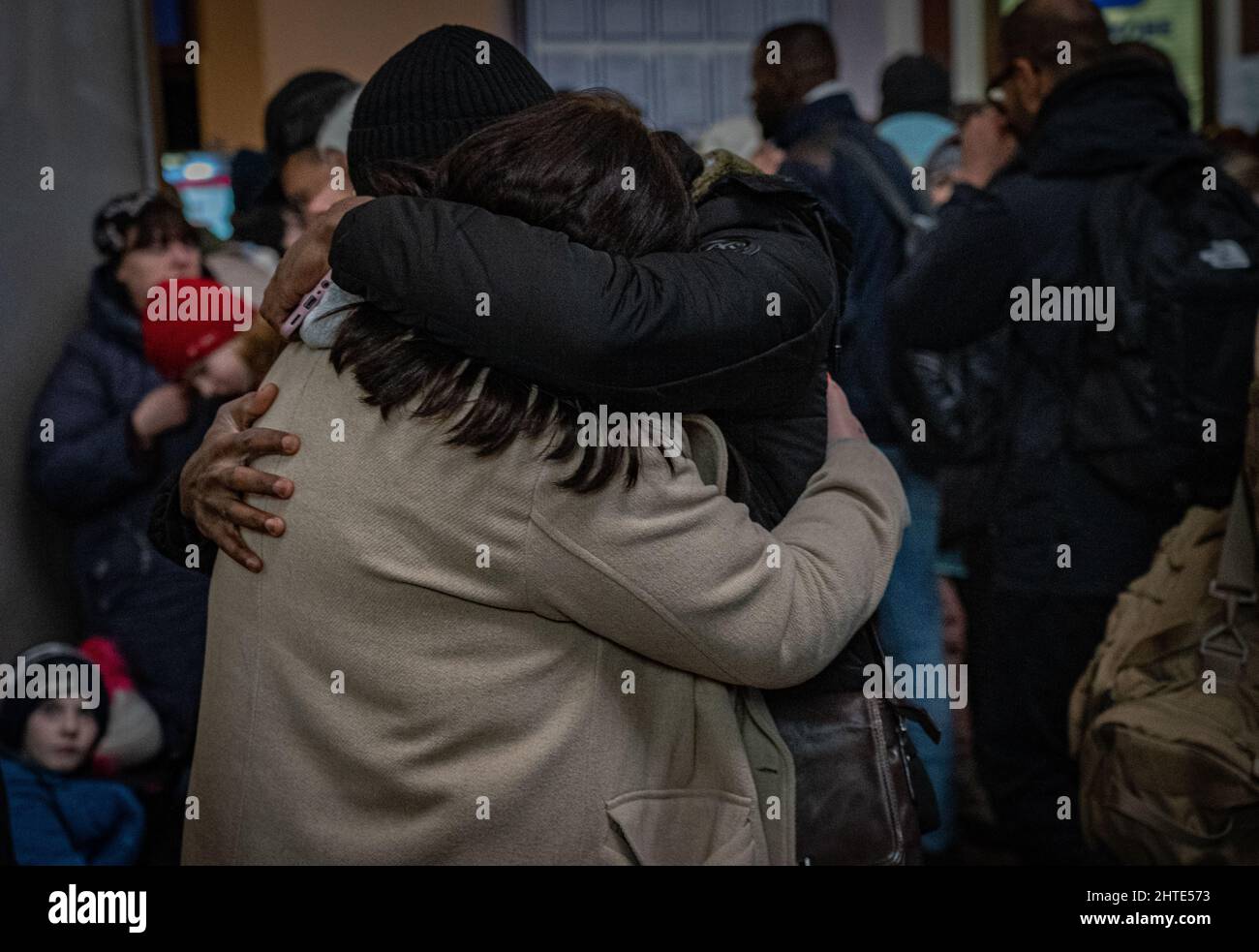 27th February 2022. Lviv Train Station, Ukraine. An emotional couple reunite at Lviv station after fleeing war as desperation grows at Ukraine border as more than half a million refugees flee war - Copyright: Bel Trew/The Credit: Independent/Alamy Live News Stock Photo