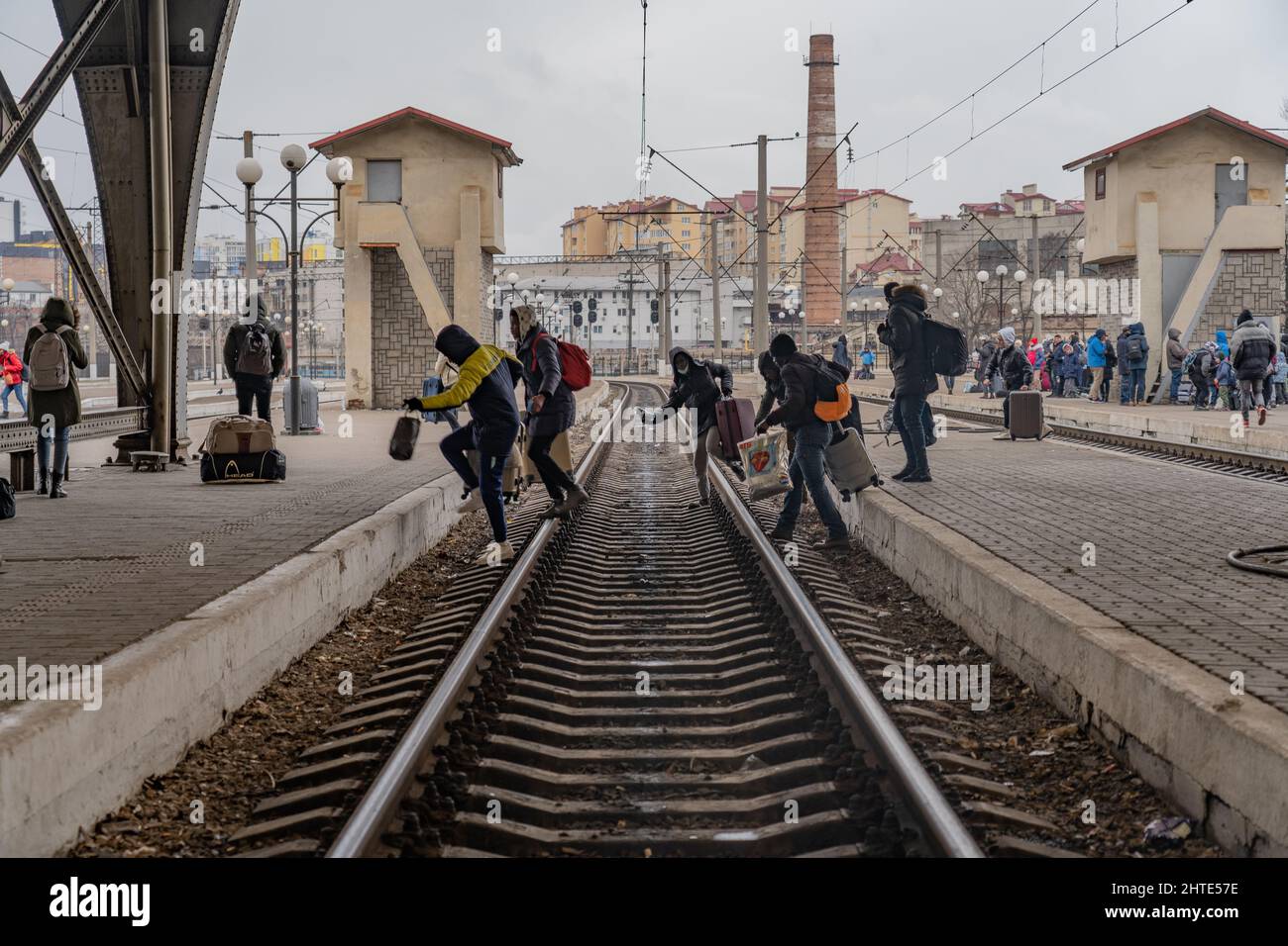 27th February 2022. Lviv Train Station, Ukraine. A group of Nigerian refugees move between platforms hoping to catch a train as desperation grows at Ukraine border as more than half a million refugees flee war - Copyright: Bel Trew/The Credit: Independent/Alamy Live News Stock Photo