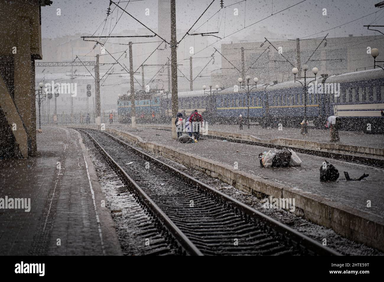 27th February 2022. Lviv Train Station, Ukraine. As snow fell on Sunday, some had to turn around and walk back to the nearest main city to find other ways out, as desperation grows at Ukraine border as more than half a million refugees flee war - Copyright: Bel Trew/The Credit: Independent/Alamy Live News Stock Photo