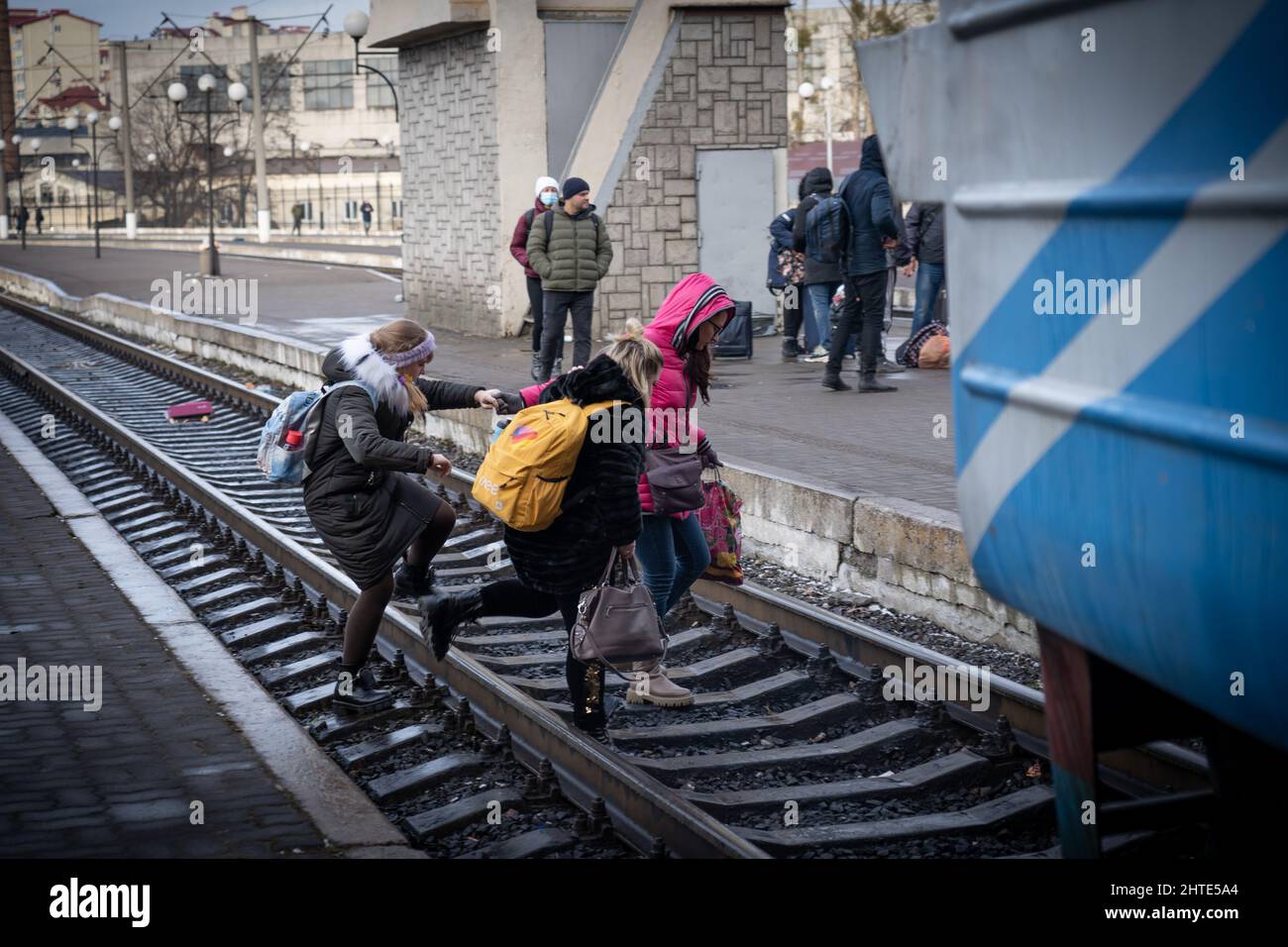 27th February 2022. Lviv Train Station, Ukraine. Temperatures dropped as families wait for a way out of the country. As snow fell on Sunday, some had to turn around and walk back to the nearest main city to find other ways out. - Copyright: Bel Trew/The Credit: Independent/Alamy Live News Stock Photo