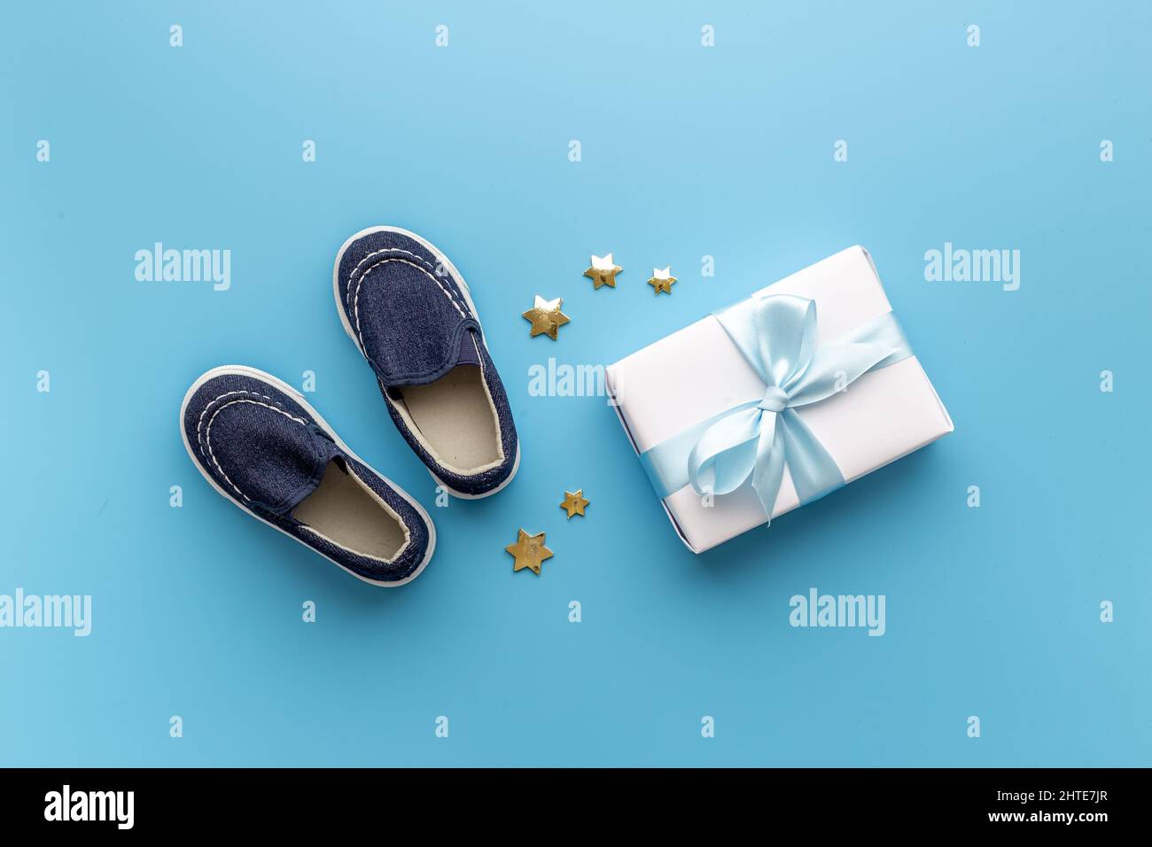 Baby boy blue shoes with gift box. Baby shower party set Stock Photo ...