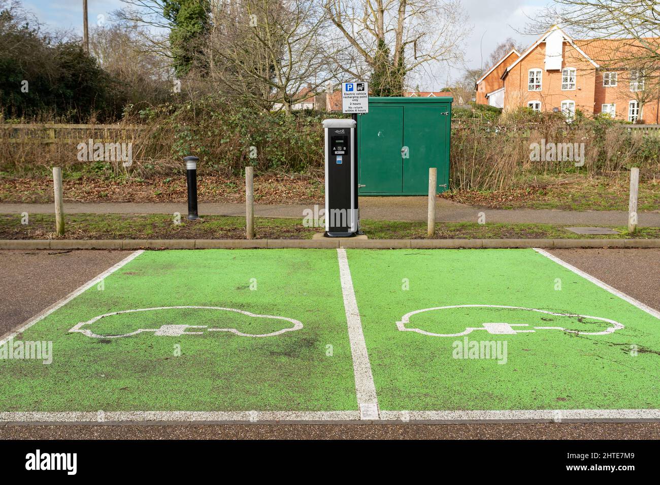 Woodbridge Suffolk UK February 22 2022: Empty green parking bays that are for electric vehicles only. There is a eVolt charging station available for Stock Photo