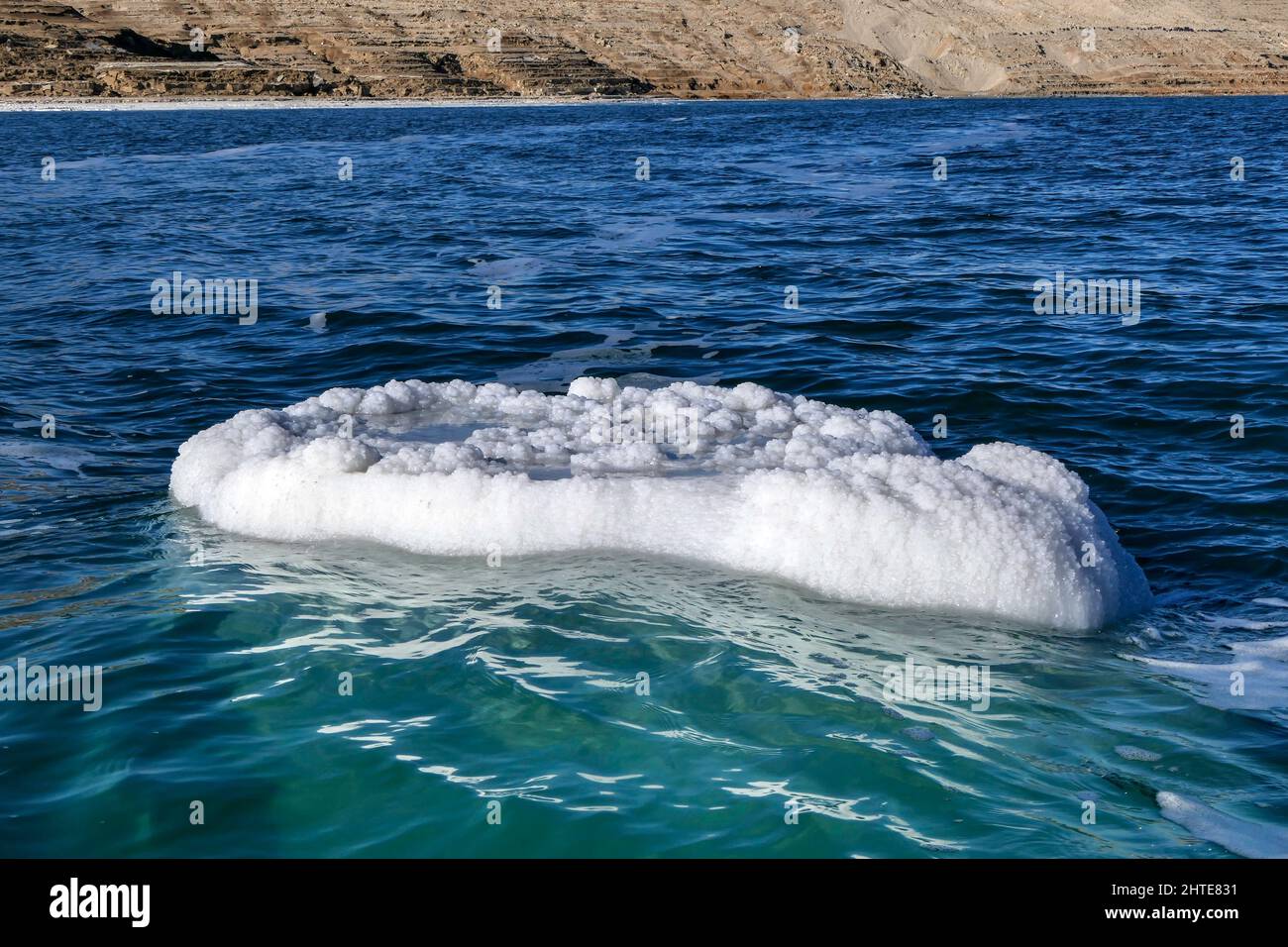 View of the salt formations protruding from the waters of the Dead Sea. Stock Photo